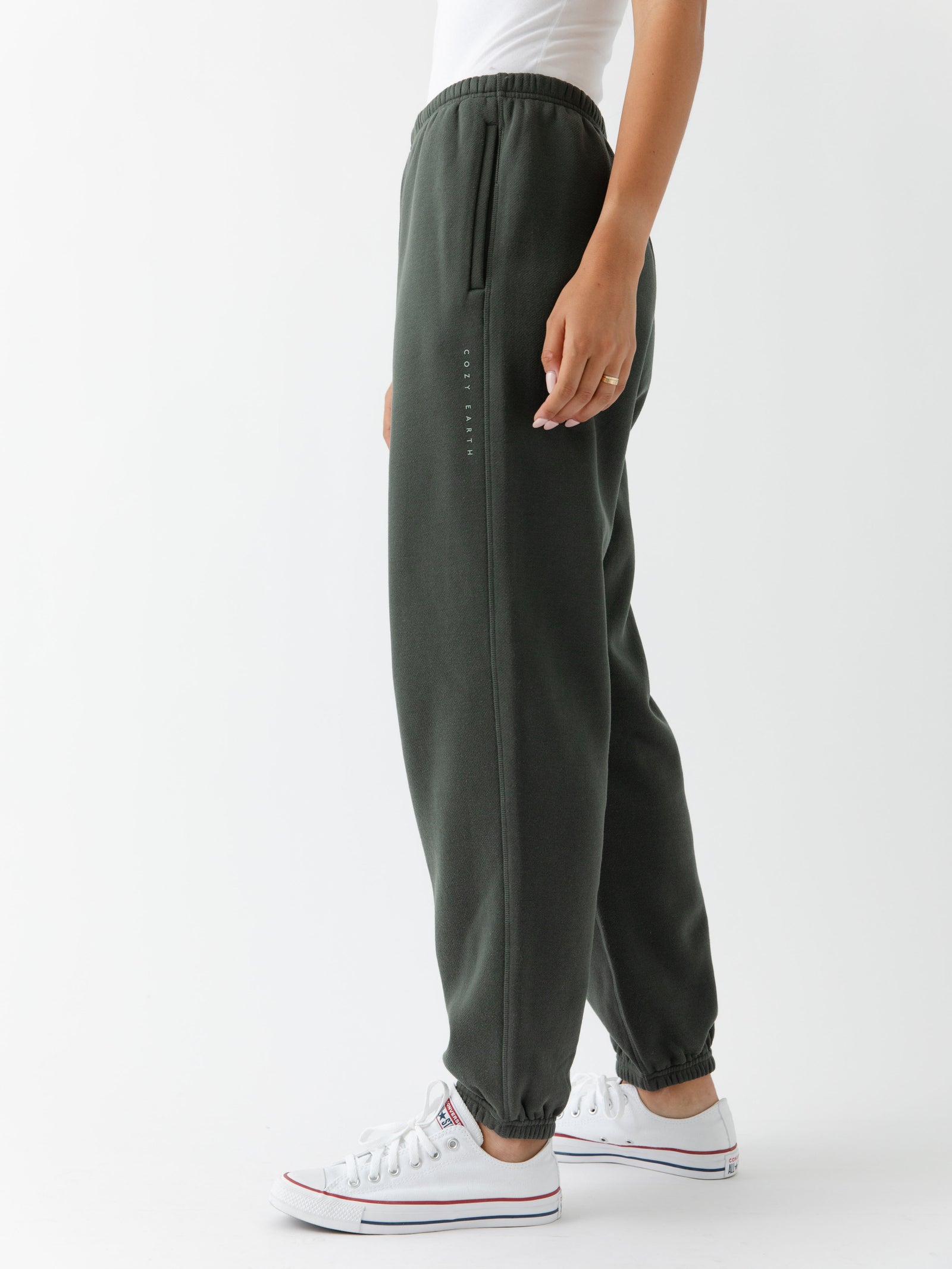 Storm CityScape Joggers. The Joggers are being worn by a female model. The photo is taken from the waist down with the models hands by her sides. The back ground is white.