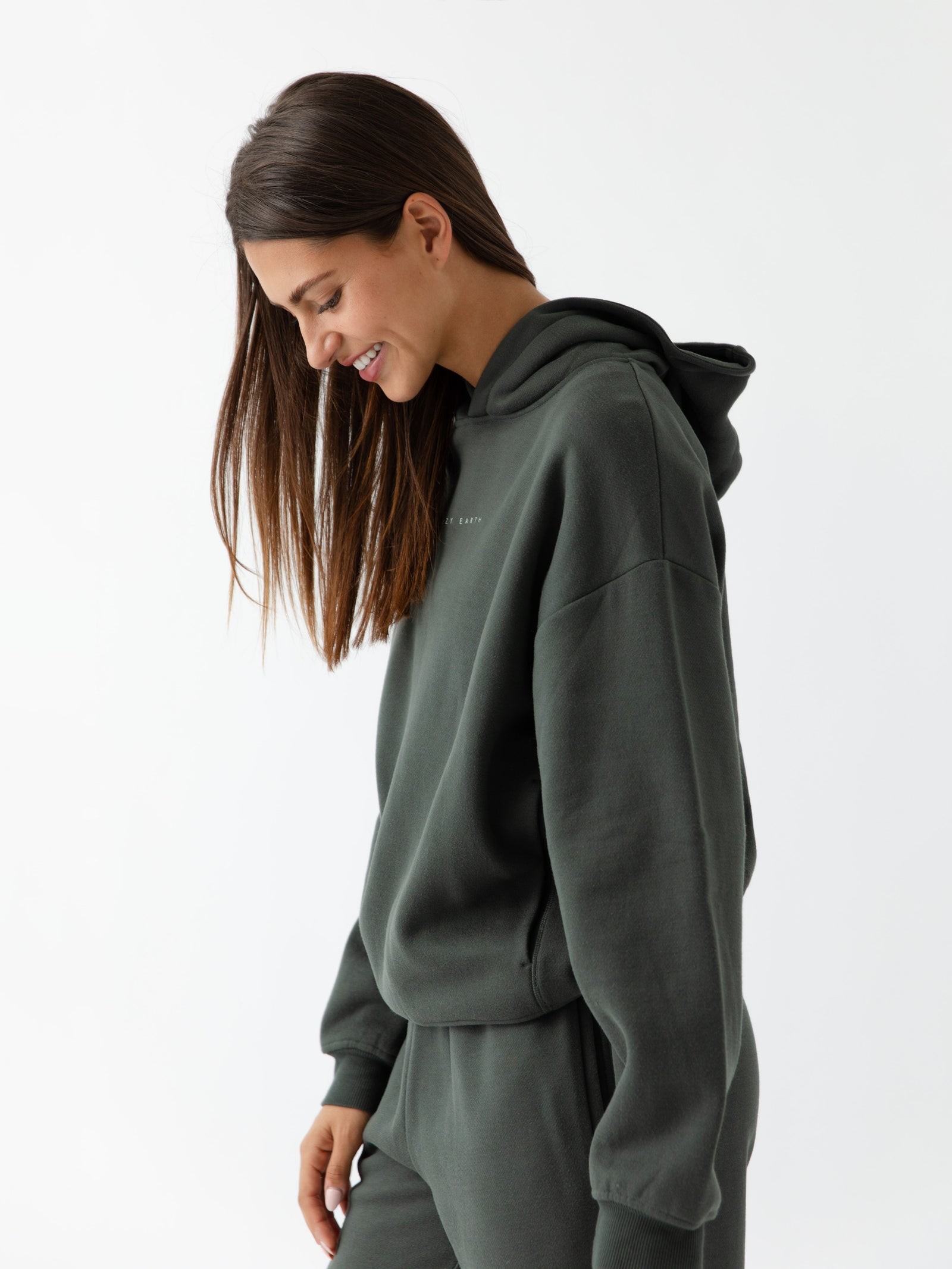 Side view of woman wearing storm cityscape hoodie