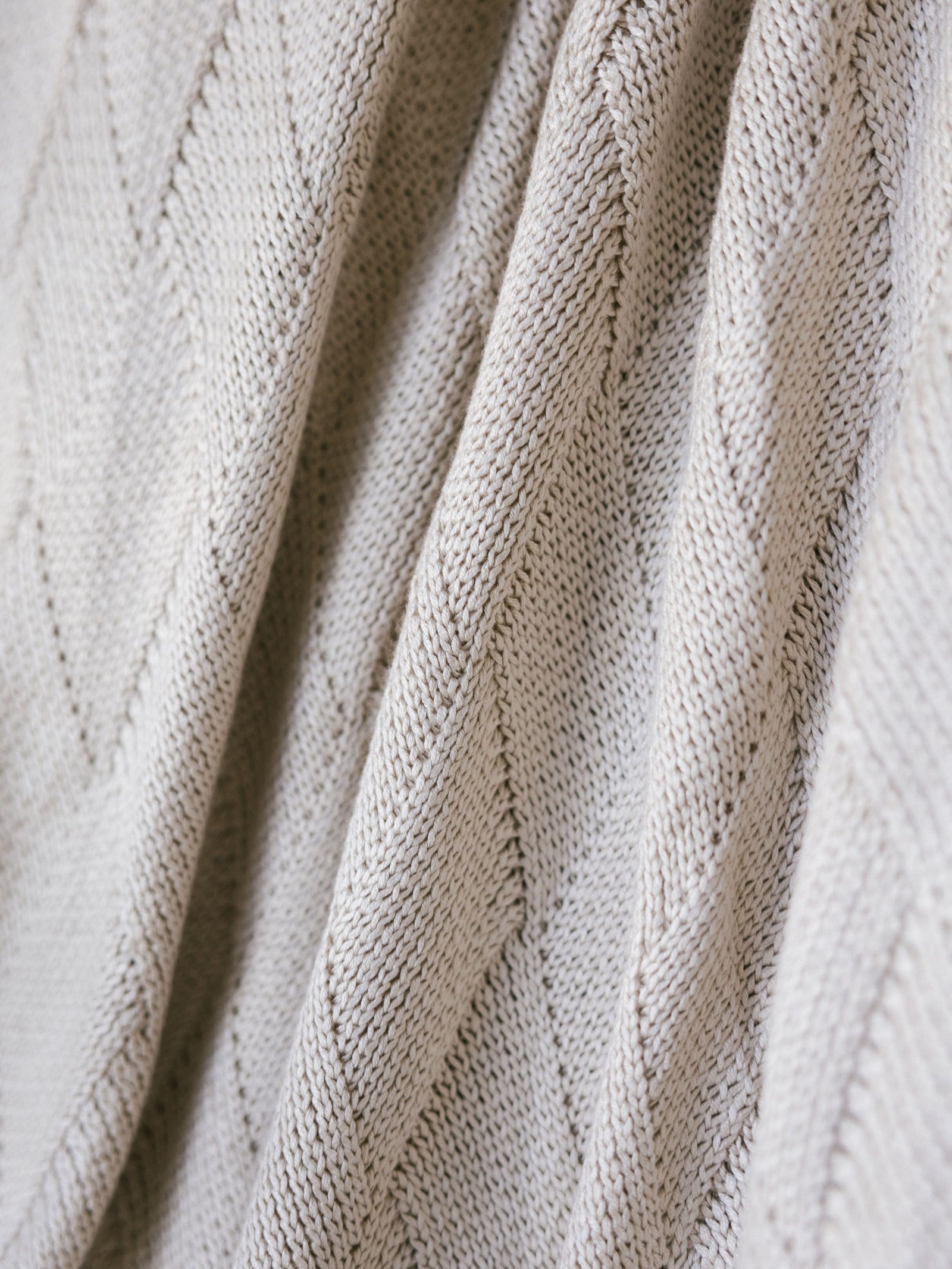 Beige Diamond Knit Blanket photographed close up. 