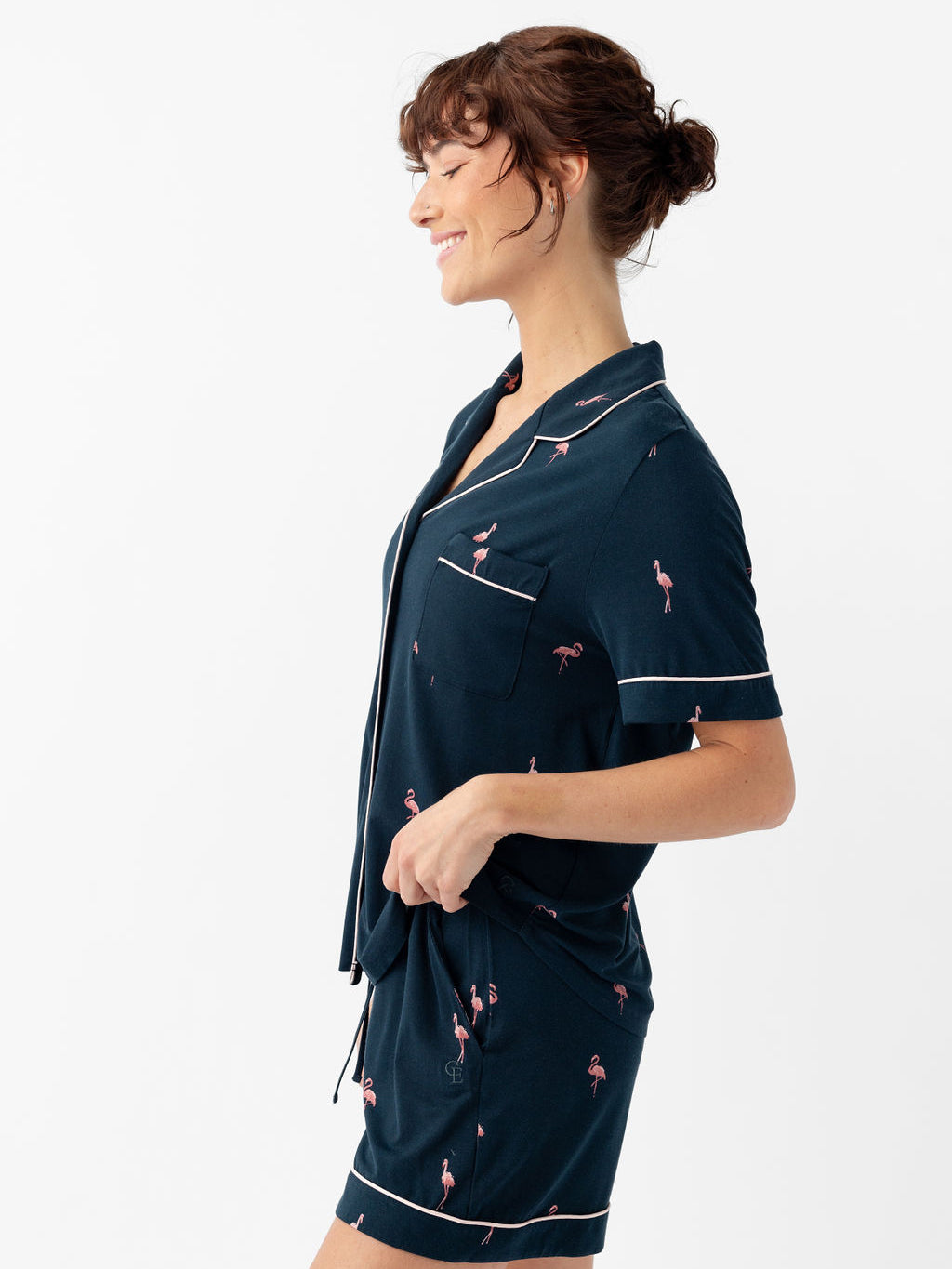 Side view of woman in short sleeve flamingo print pajama set 