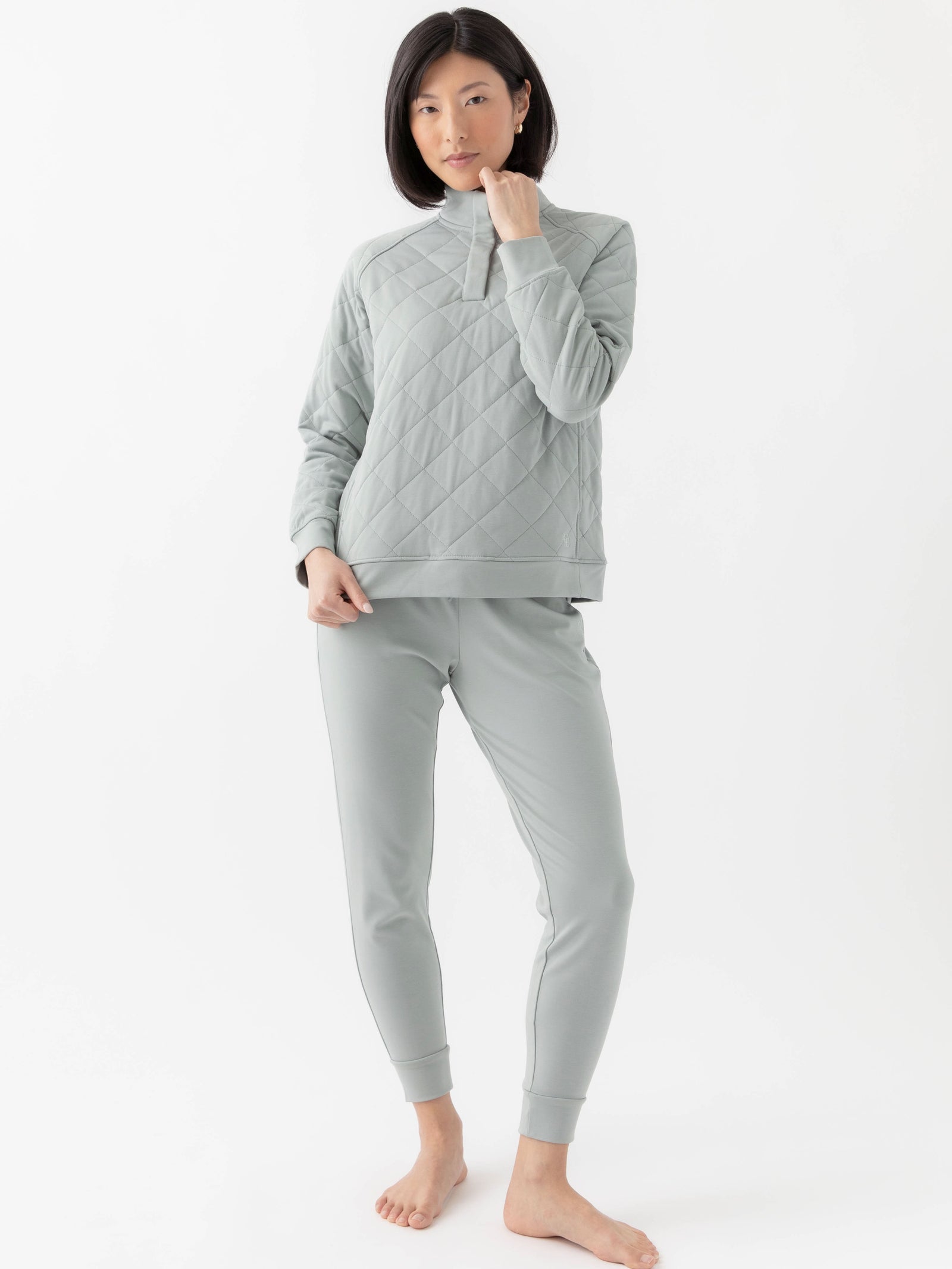 Woman wearing a white Cozy Earth Brushed Bamboo Quilted Pullover against a white background