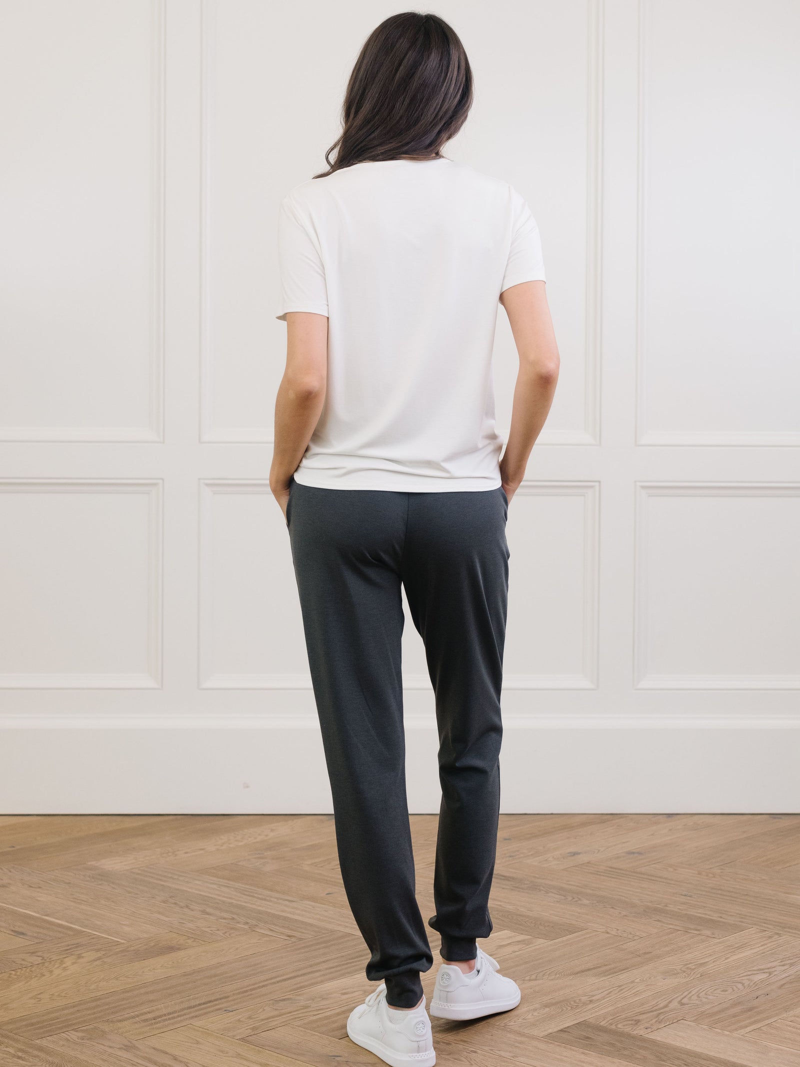 Woman wearing Cozy Earth Bamboo Lounge Tee in ivory faces backward