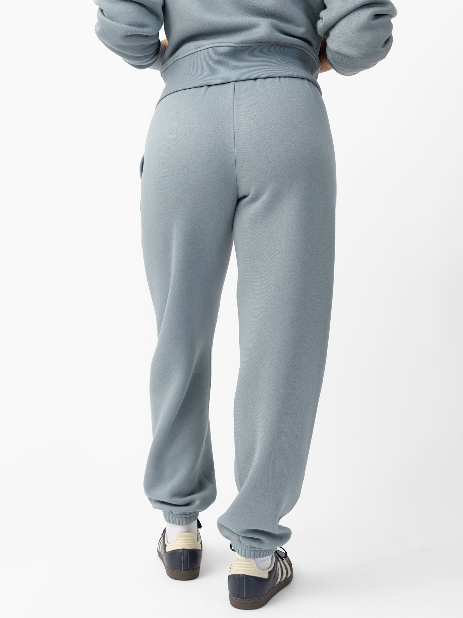 Woman wearing Smokey Blue CityScape Sweat Pant with white background
