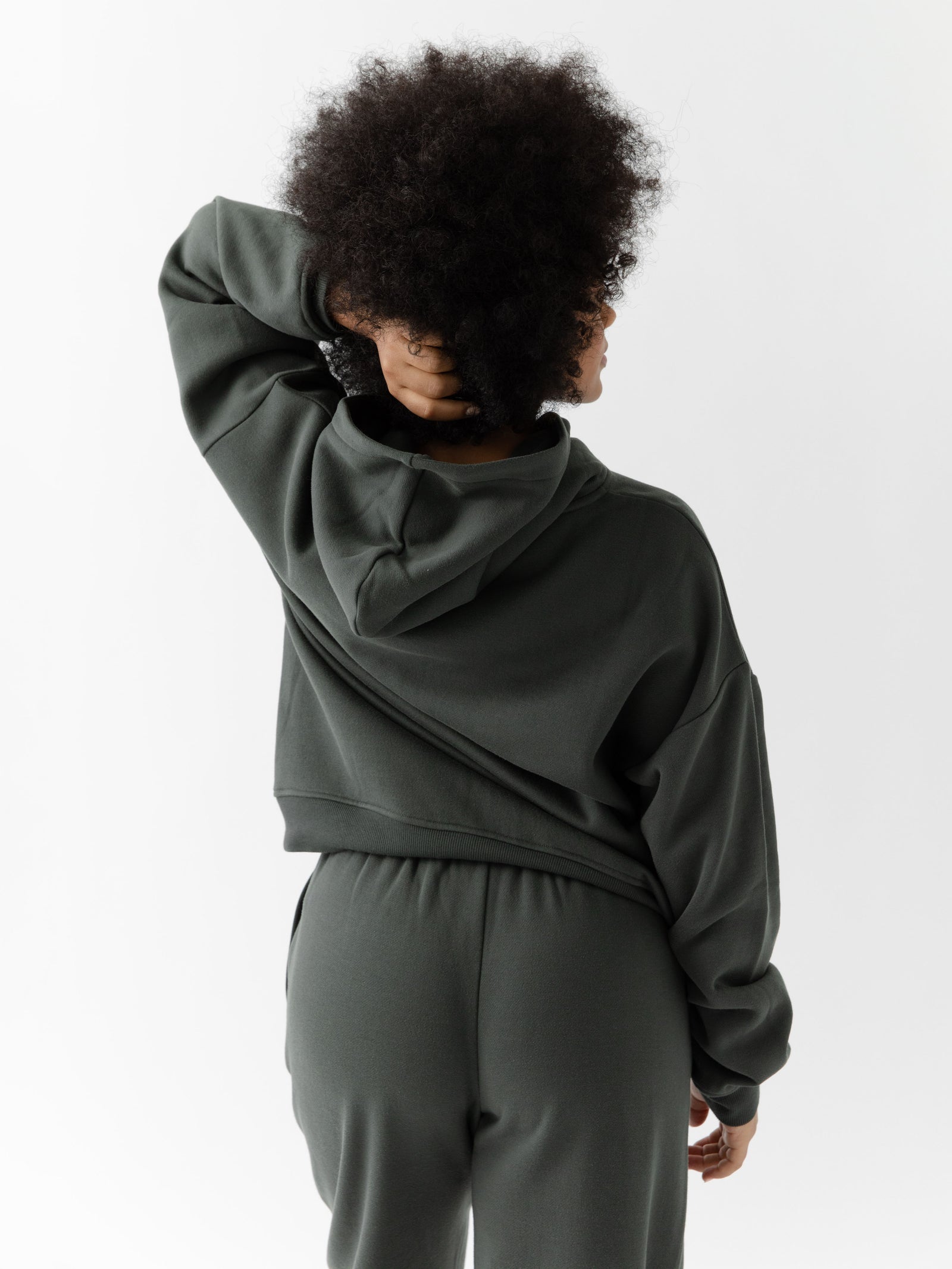 Back of woman wearing storm cityscape hoodie