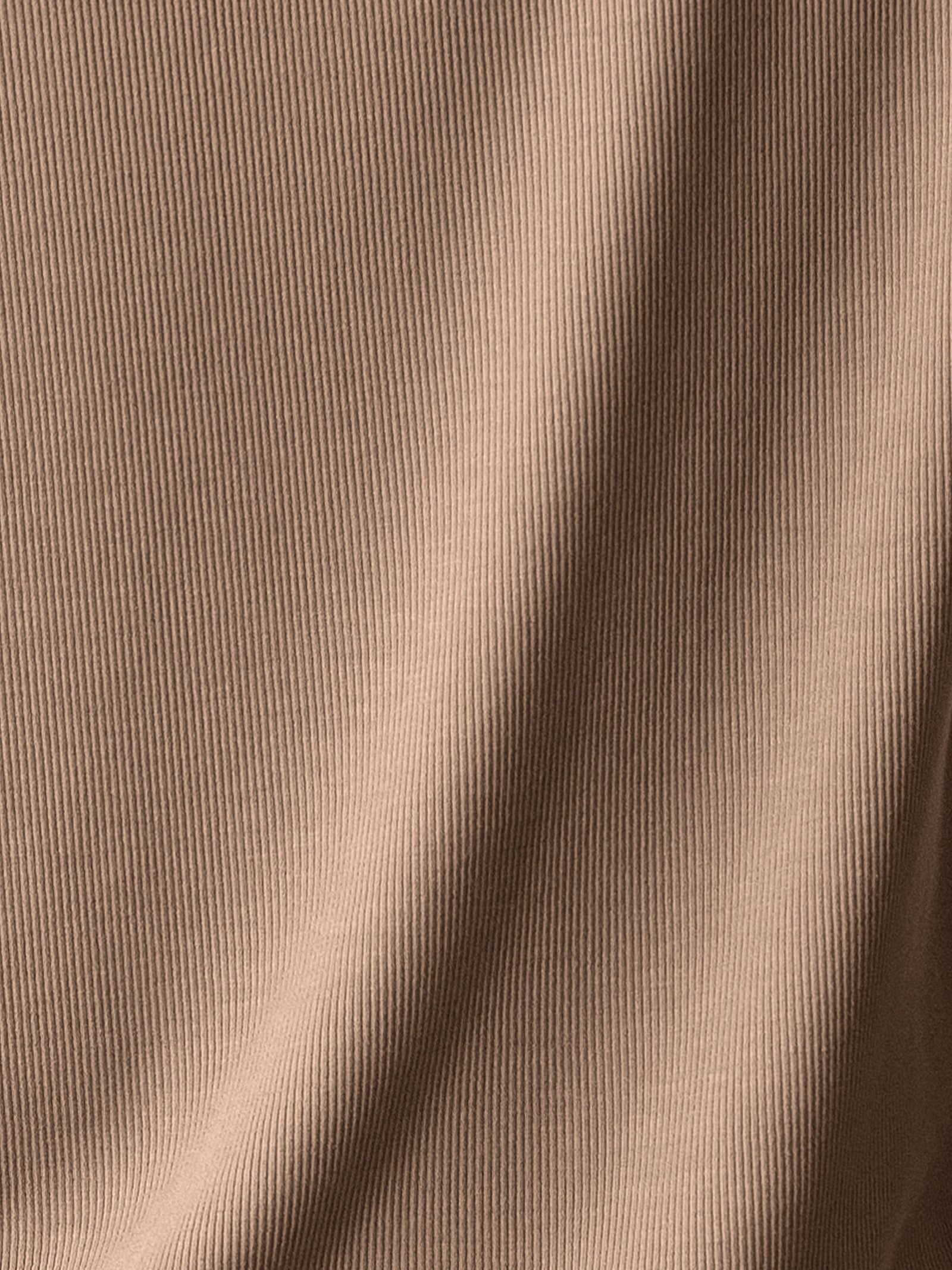 A swatch of tan rib knit fabric