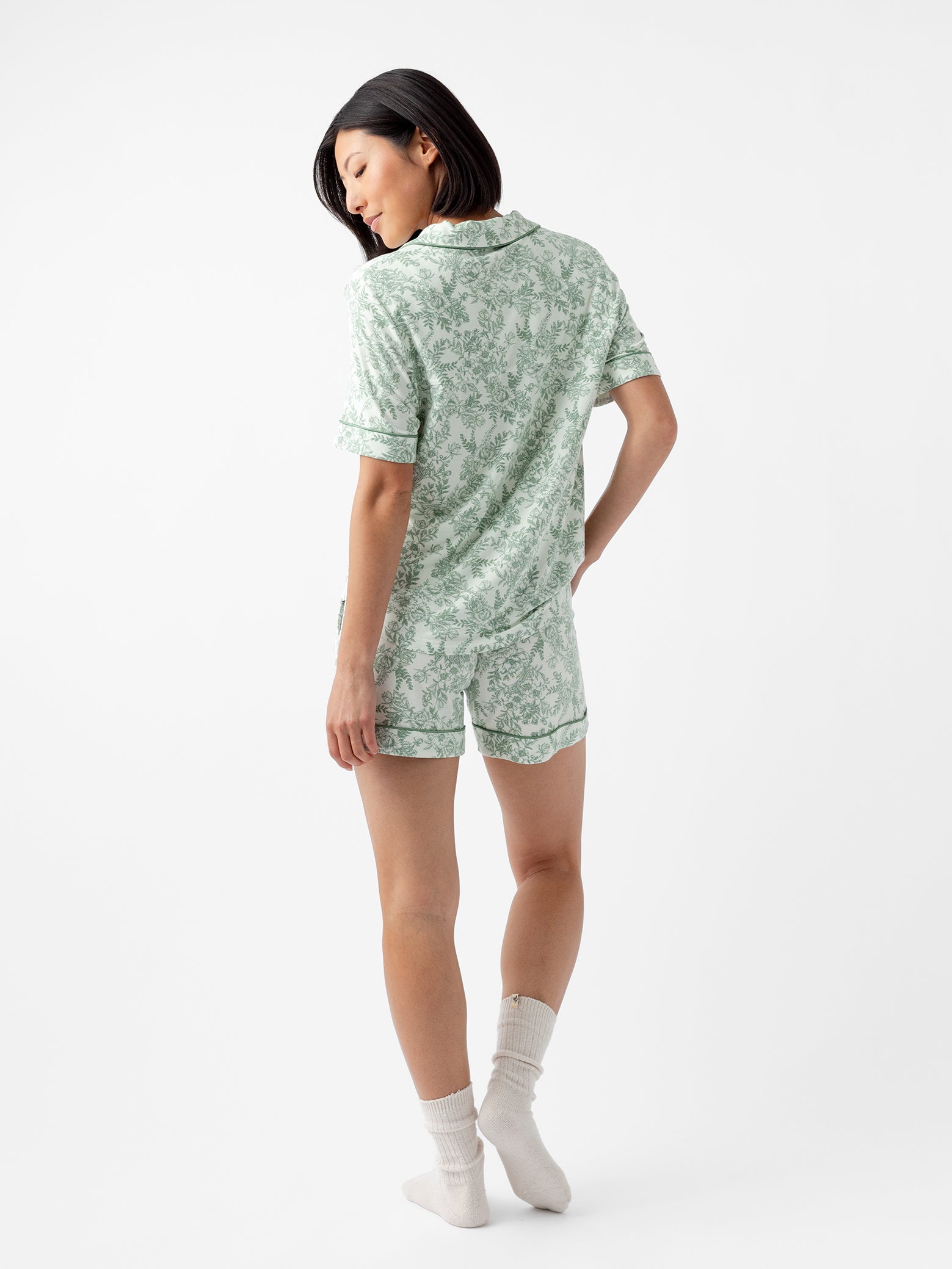 Back of woman in short sleeve celadon toile pajama set