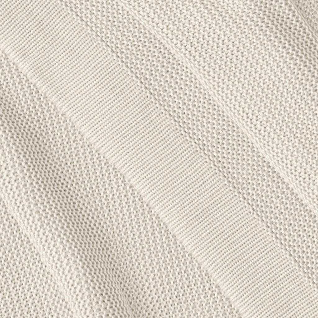 Close up of driftwood cloud knit blanket