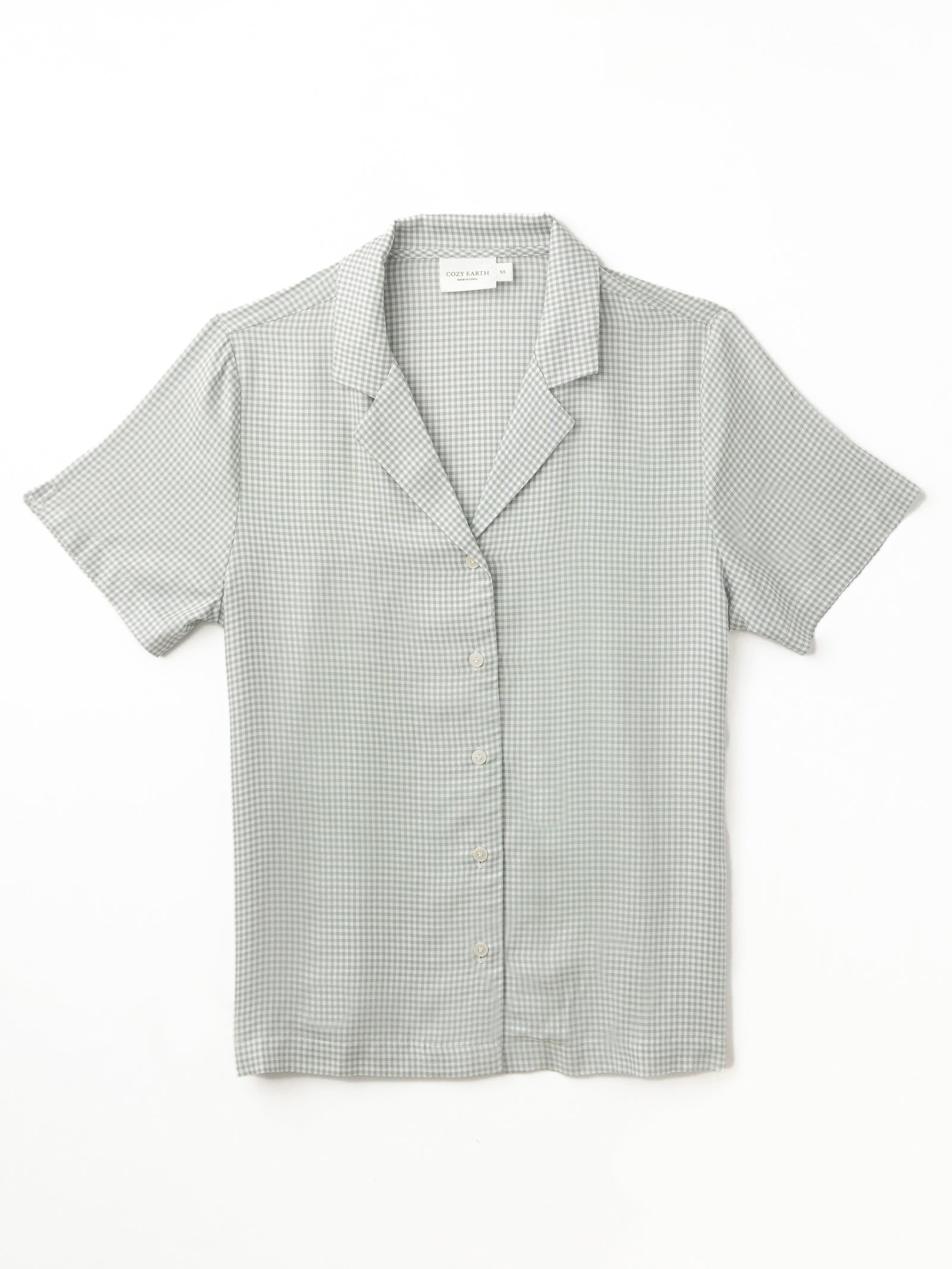 Flat lay of haze mini gingham pajama top with white background