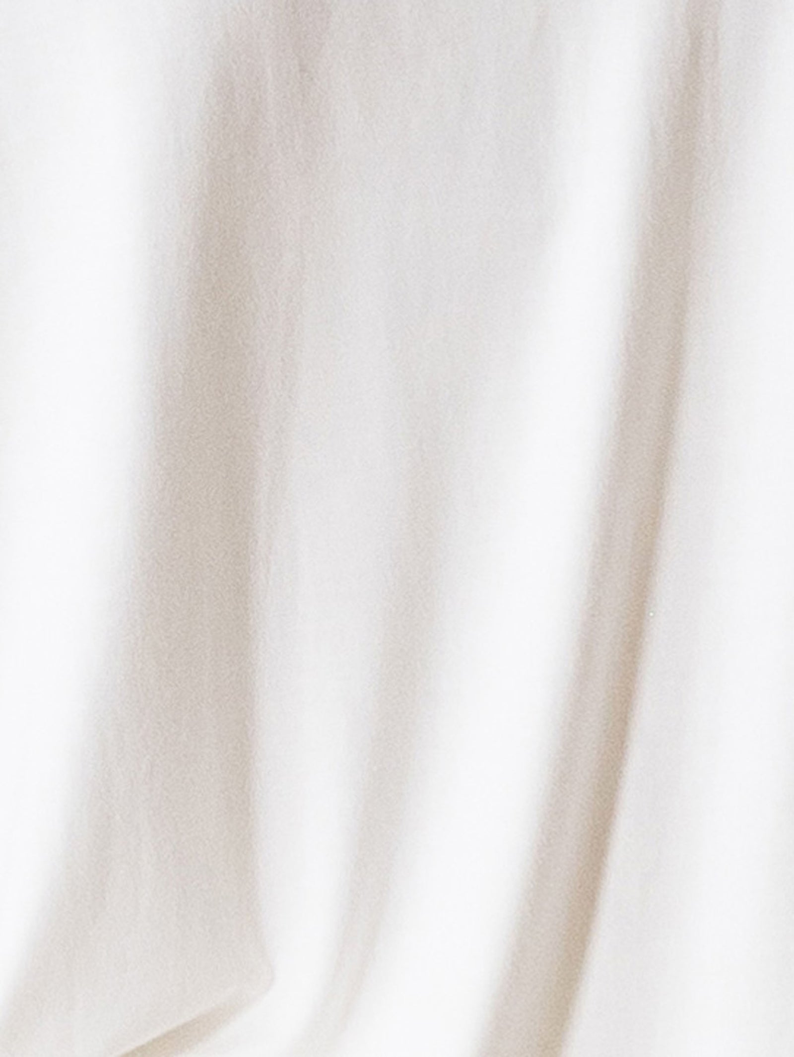 Ivory Short Sleeve Pajama Set. The photo was taken close up, showing off the print of the pajamas.