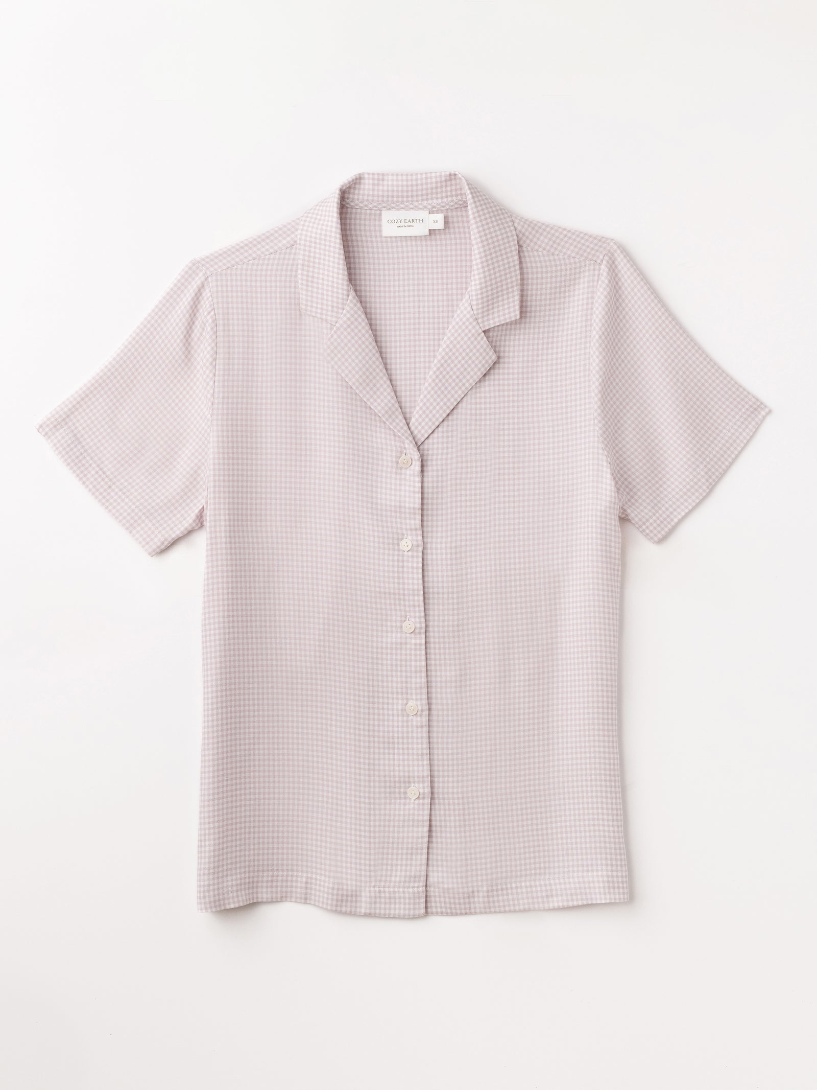Flat lay of lavender mini gingham pajama top with white background