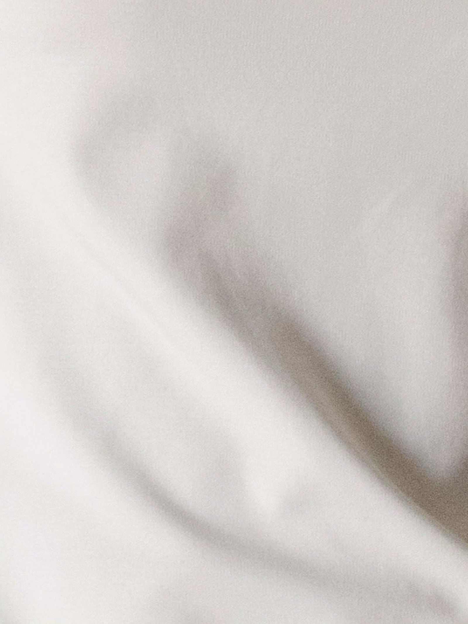 Light Grey Men's Bamboo Jogger Set. Photo taken close to the material so that the texture can be seen.