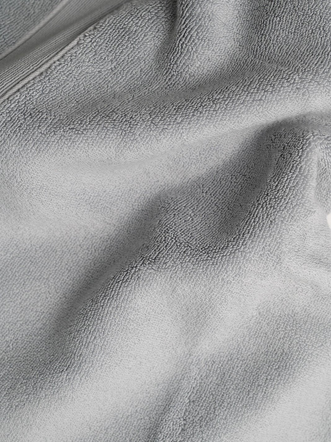 Close up of light grey luxe bath fabric 
