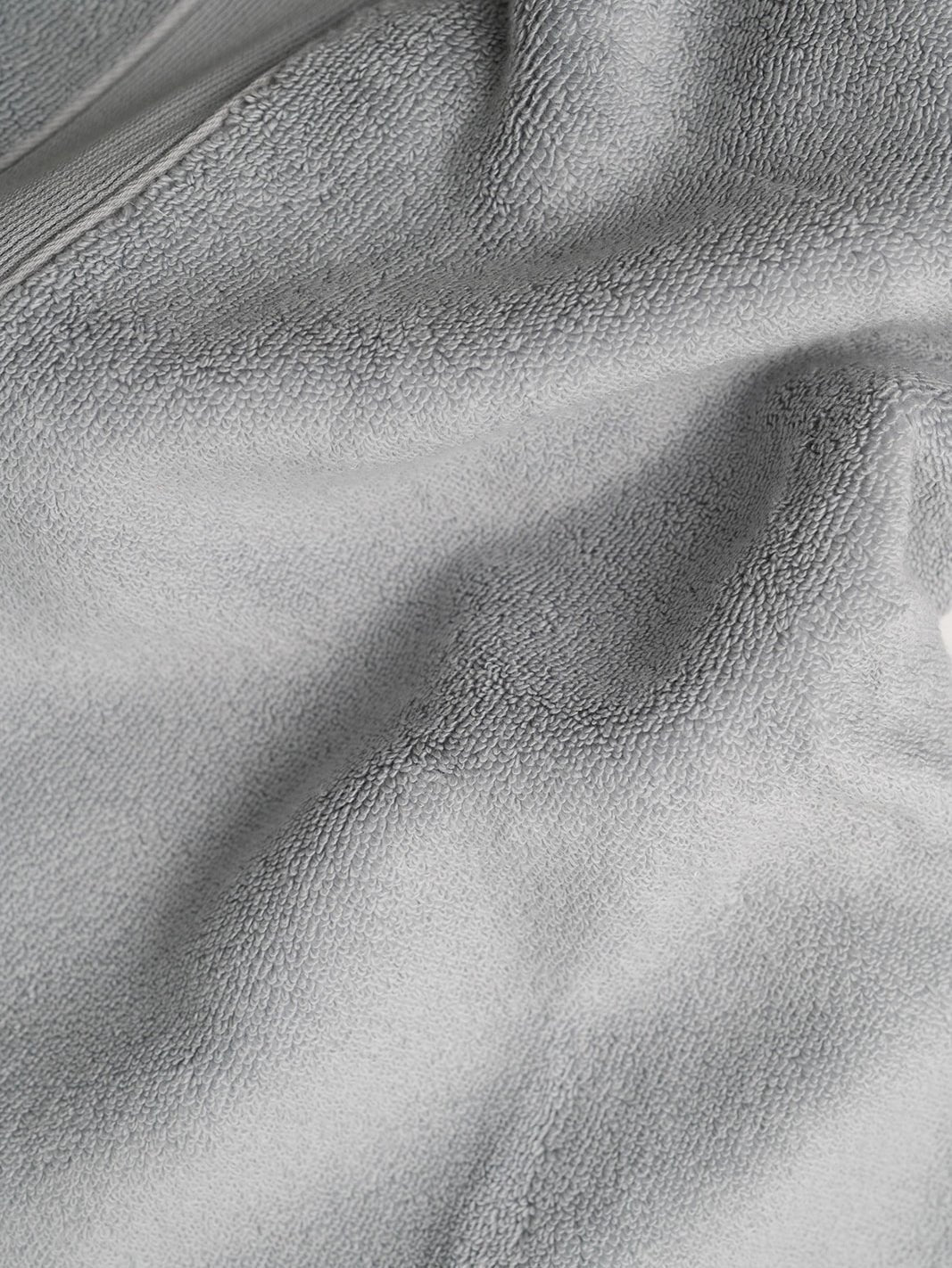 Close up of light grey luxe bath fabric