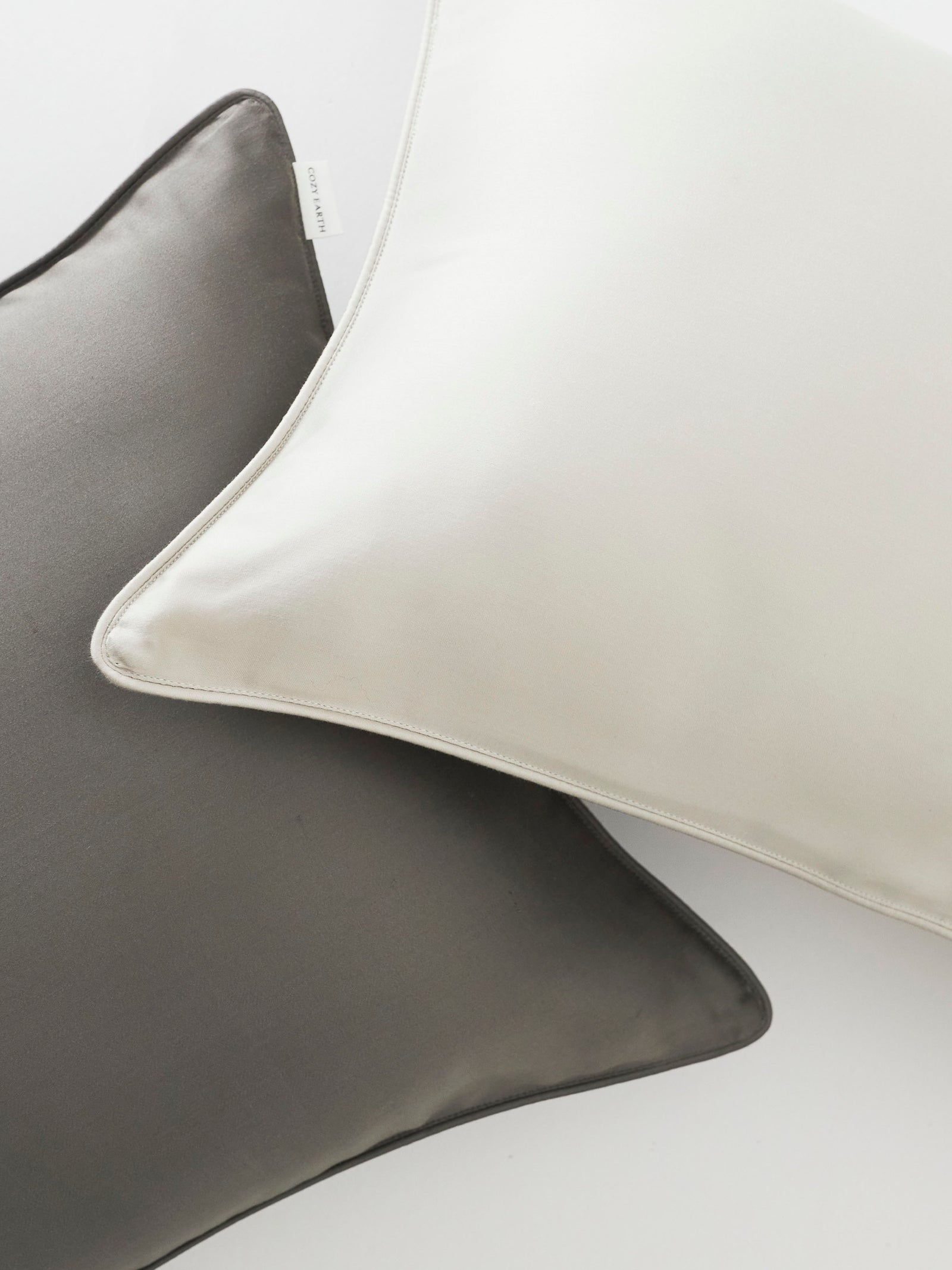 Close up of light grey and charcoal travel pillowcases 