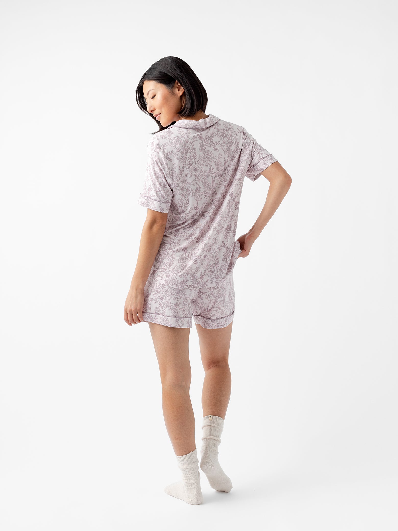 Back of woman in lilac toile short sleeve pajama set