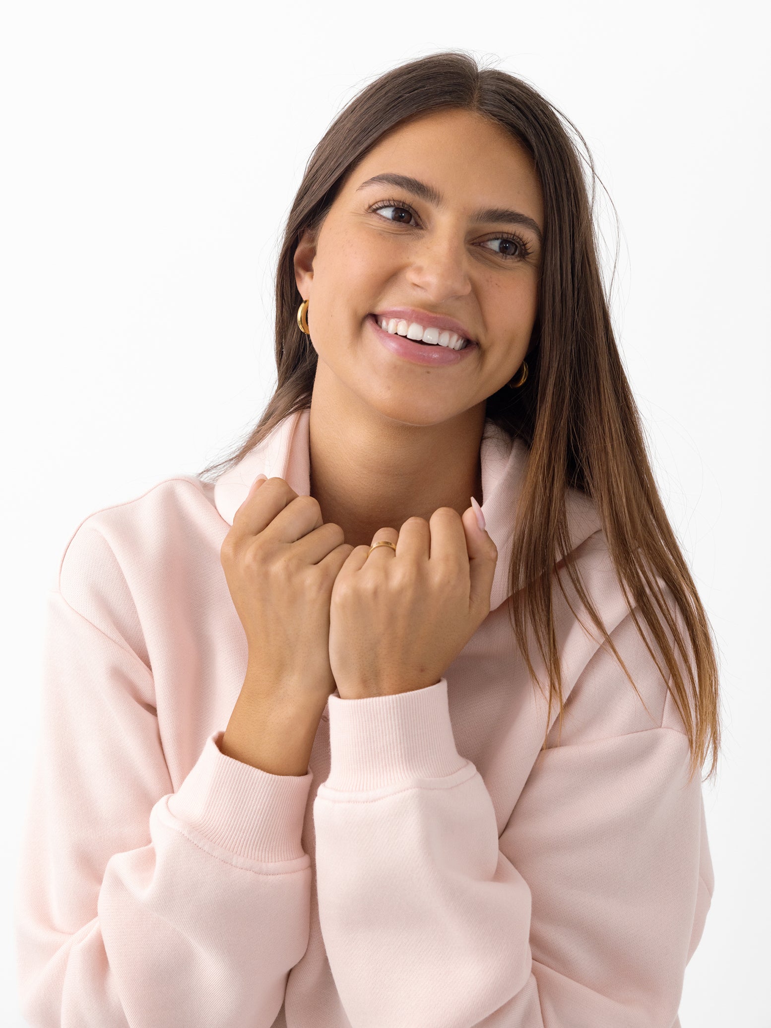 Woman smiling wearing peony cityscape hoodie with white background 