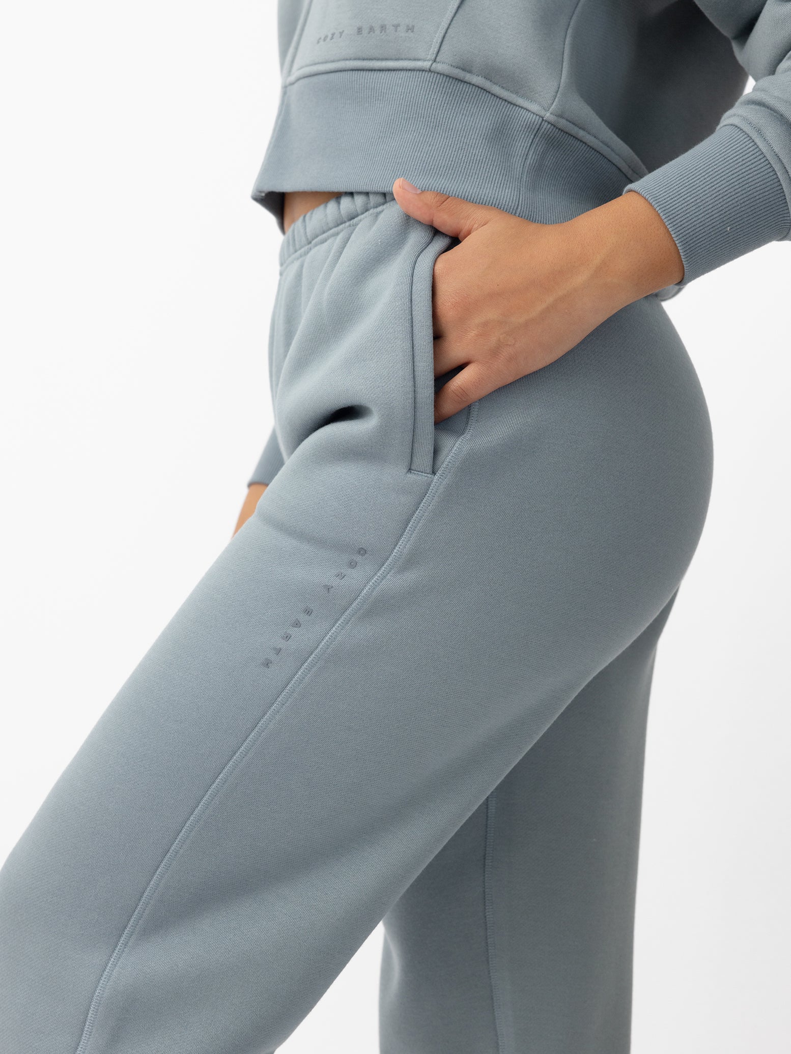Woman wearing Smokey Blue CityScape Sweat Pant with white background