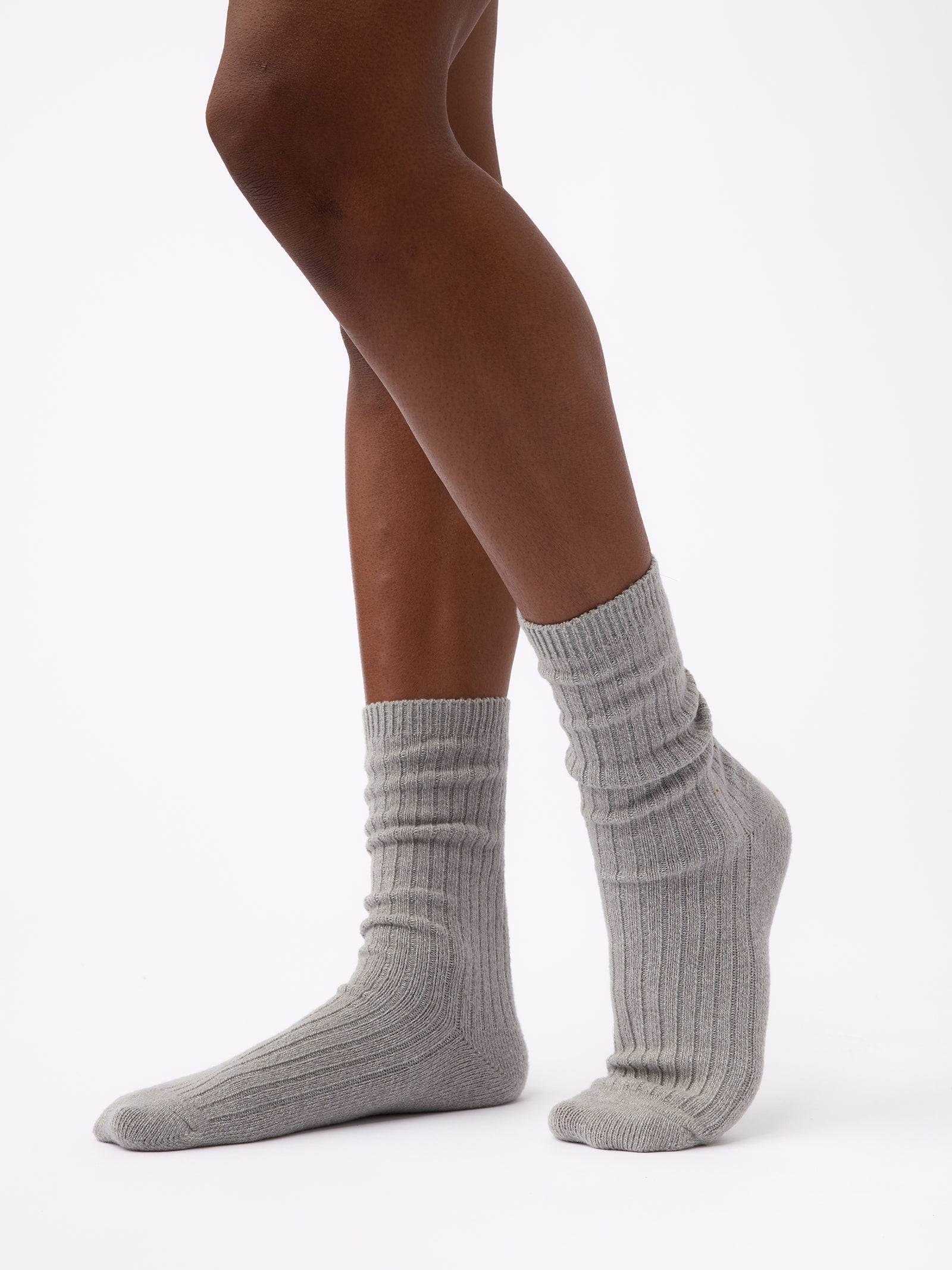 Woman wearing Cozy Earth Plush Lounge Sock 1-Pack in Stone