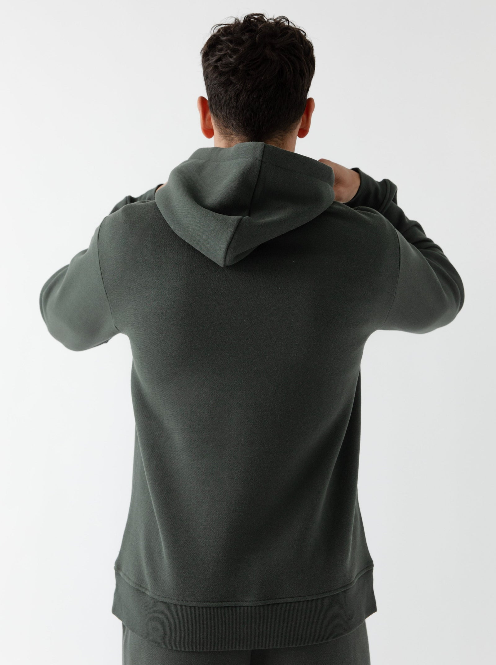 Back of man wearing storm cityscape hoodie