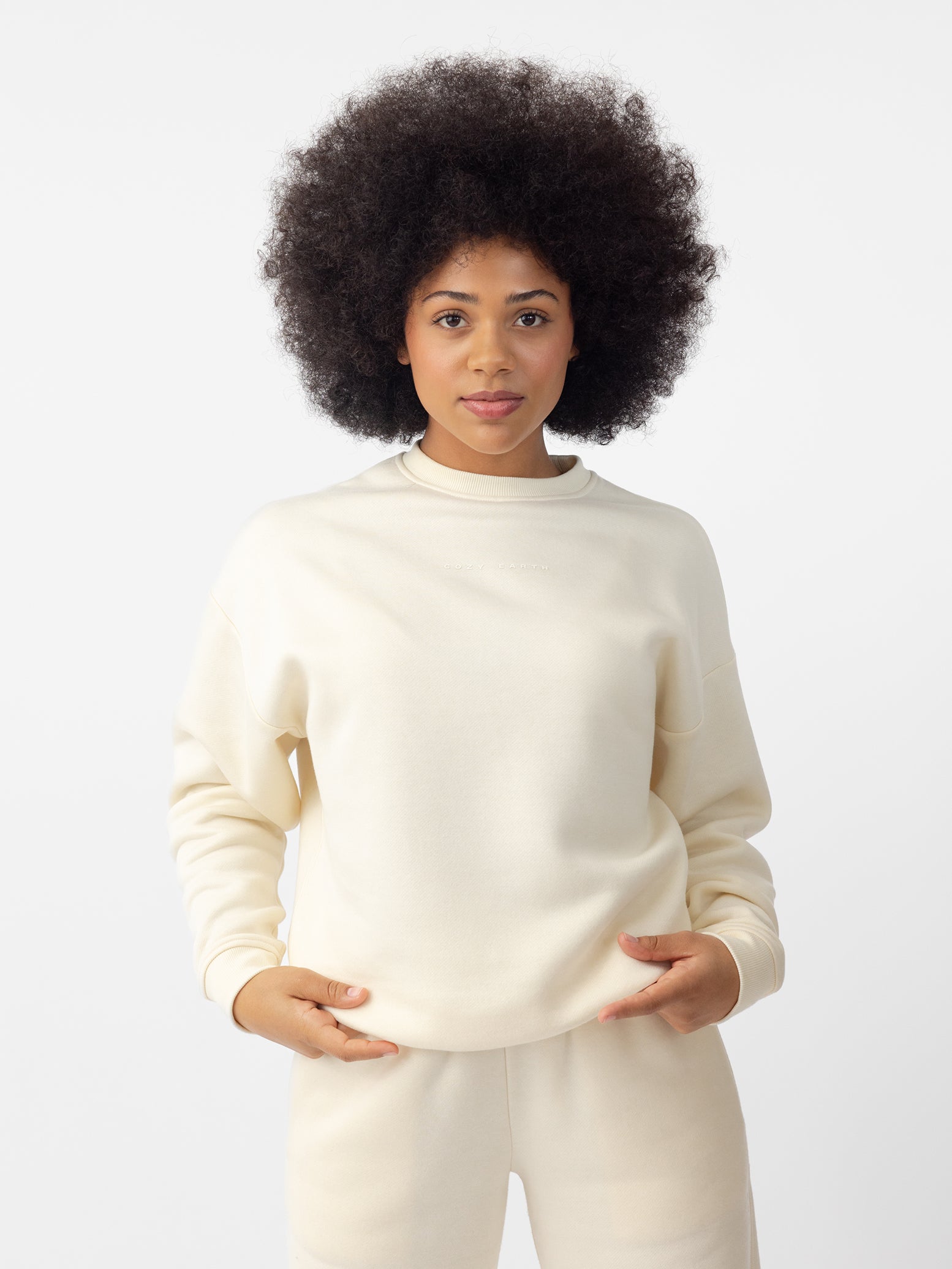 Woman wearing Alabaster CityScape Crewneck with white background |Color: Alabaster