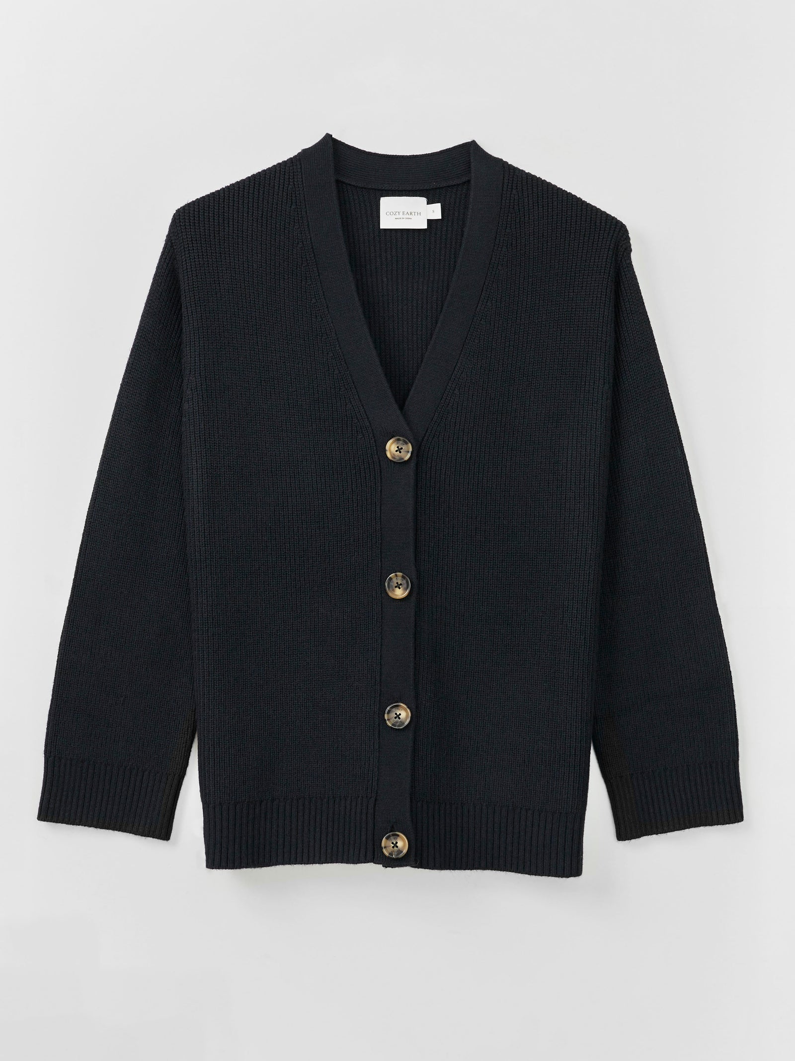 A Cozy Earth Classic Cardigan in Black lies on a white background