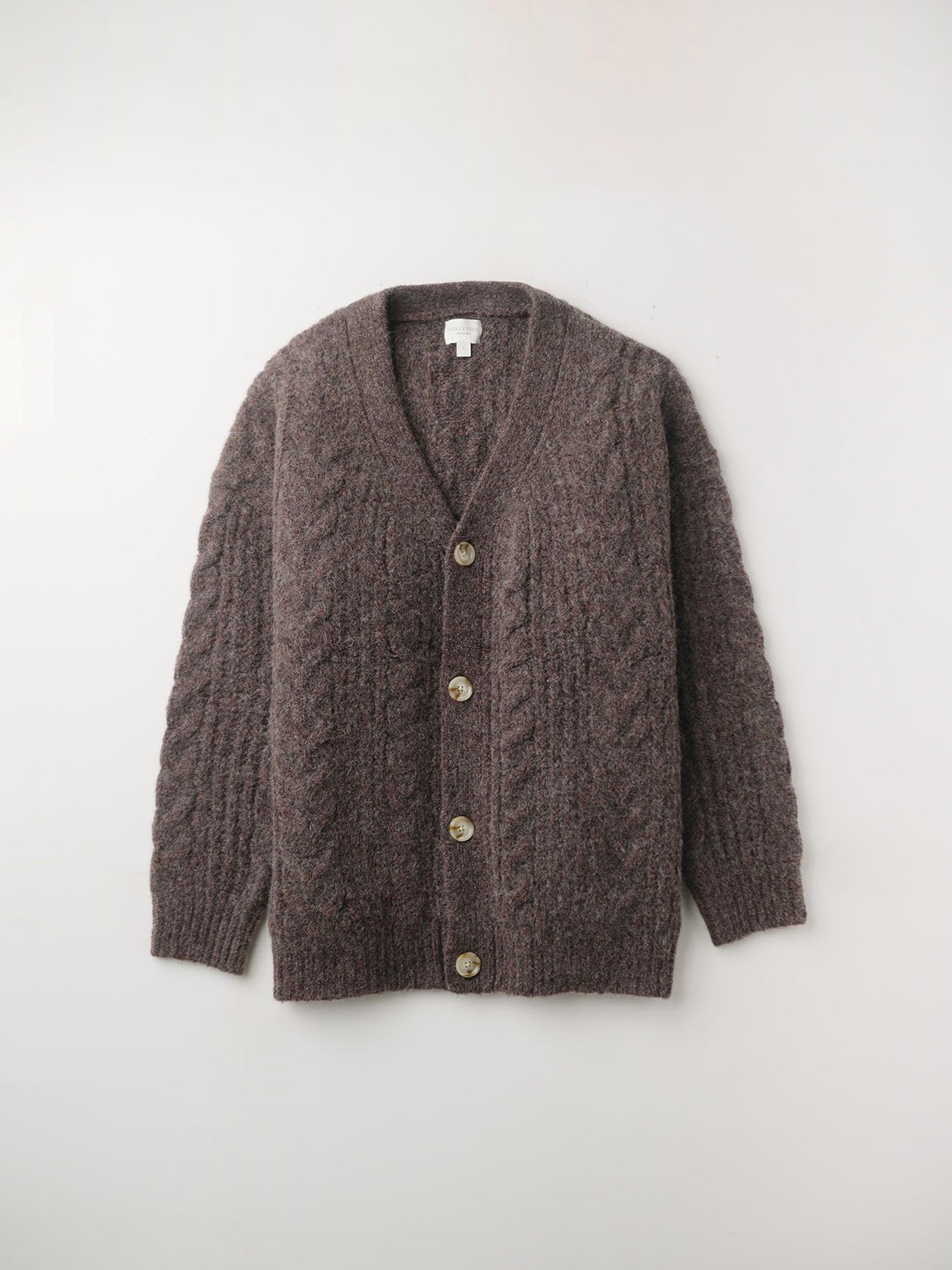 Flat lay of bordeauc cable knit cardigan with white background