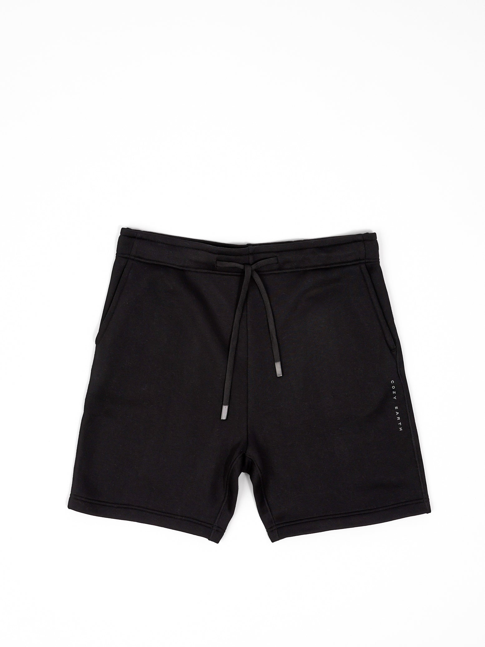 Flat lay of black cityscape shorts with white background