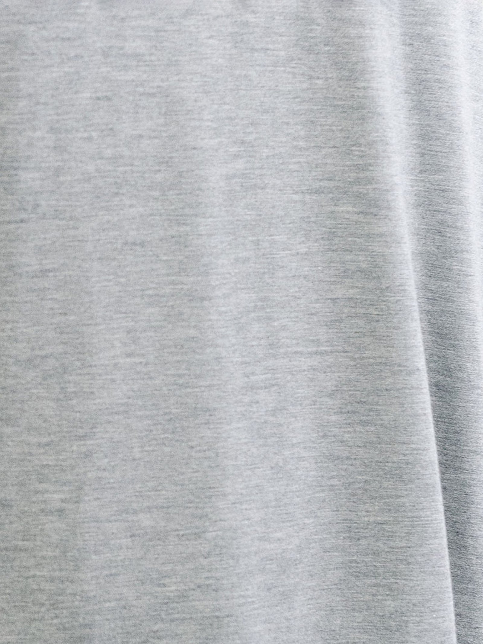 Heather Grey Men's Stretch-Knit Bamboo Lounge Tee. The photo is taken close up so as to better show the texture of the material.