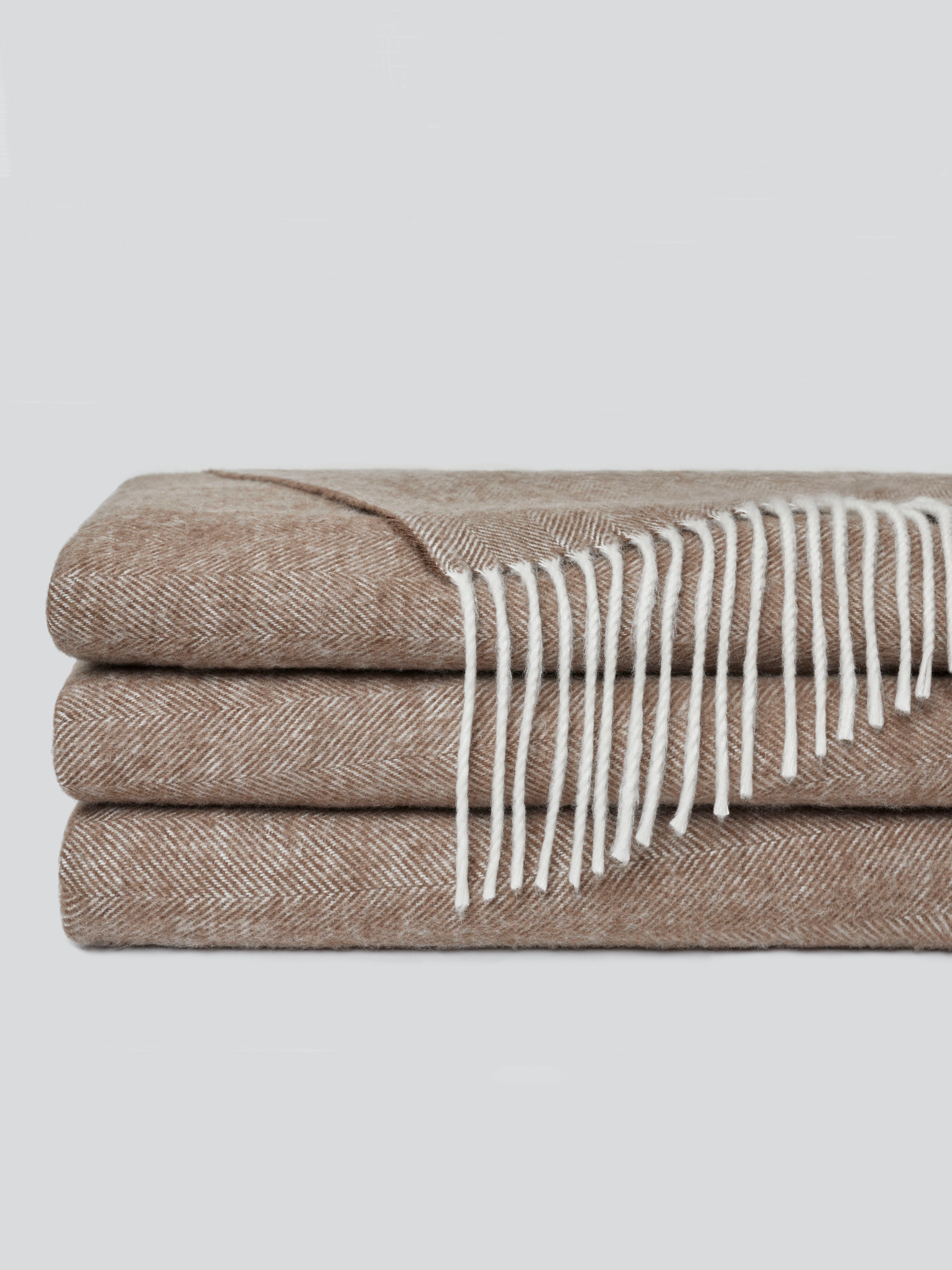 Truffle tassel throw folded with off-white background |Color:Truffle