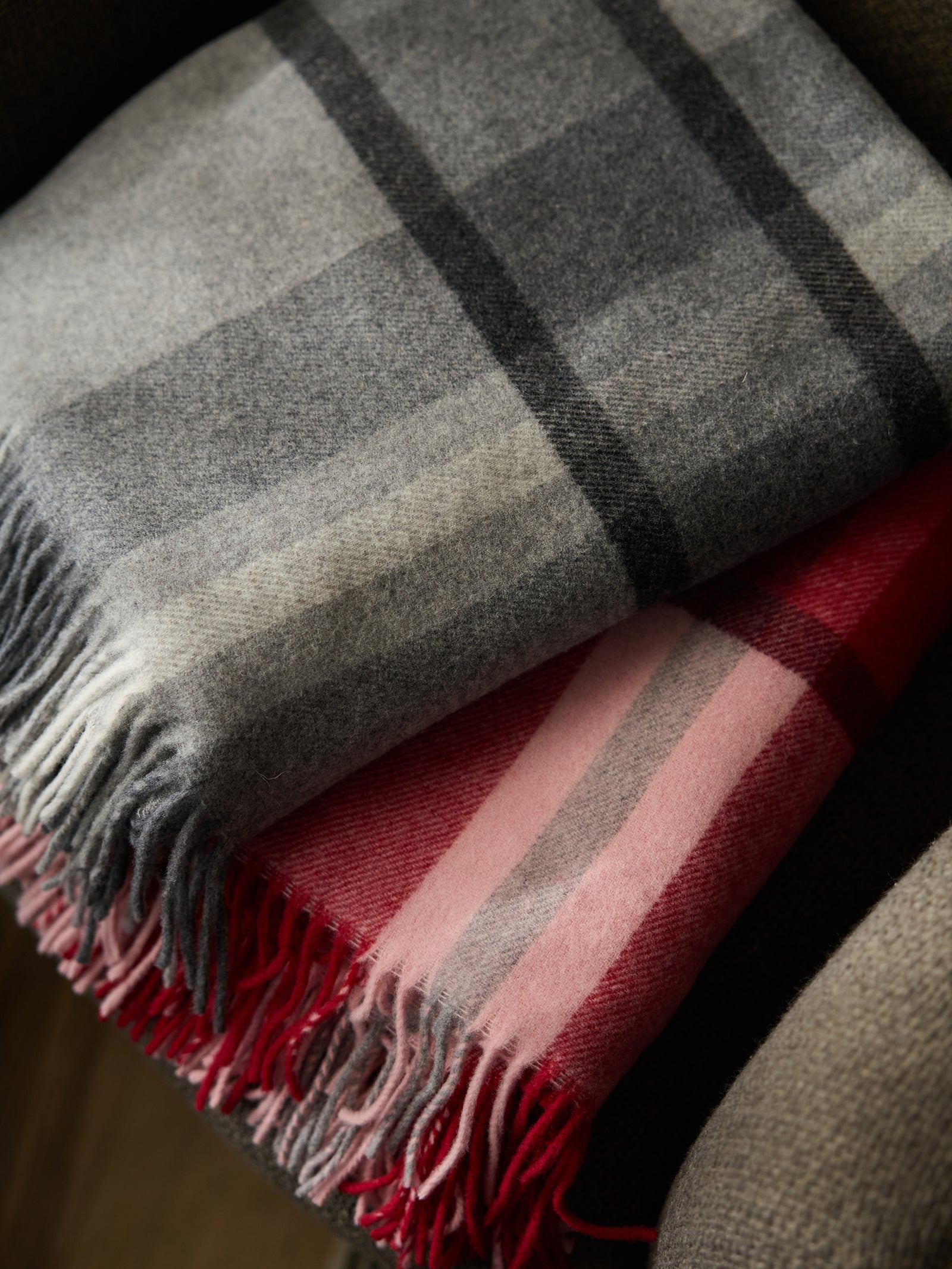 Grey and pink lucca throws folded
