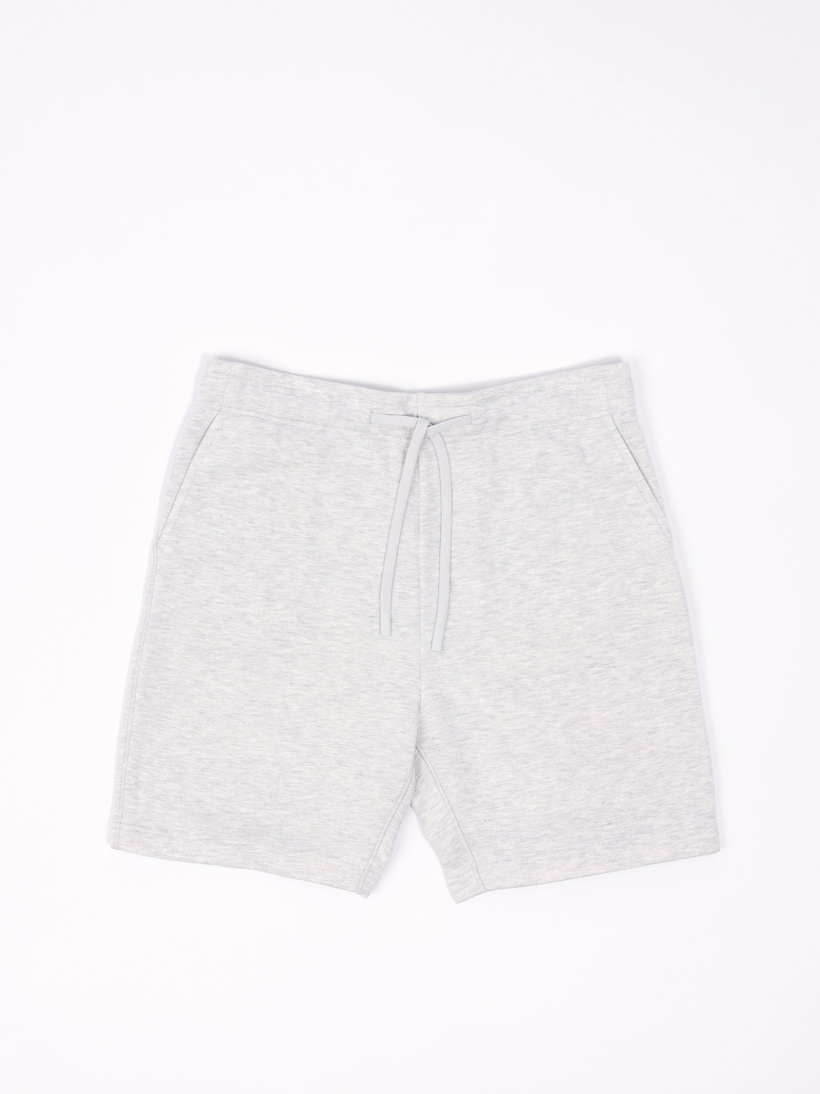 Flat lay of heather grey cityscape shorts with white background