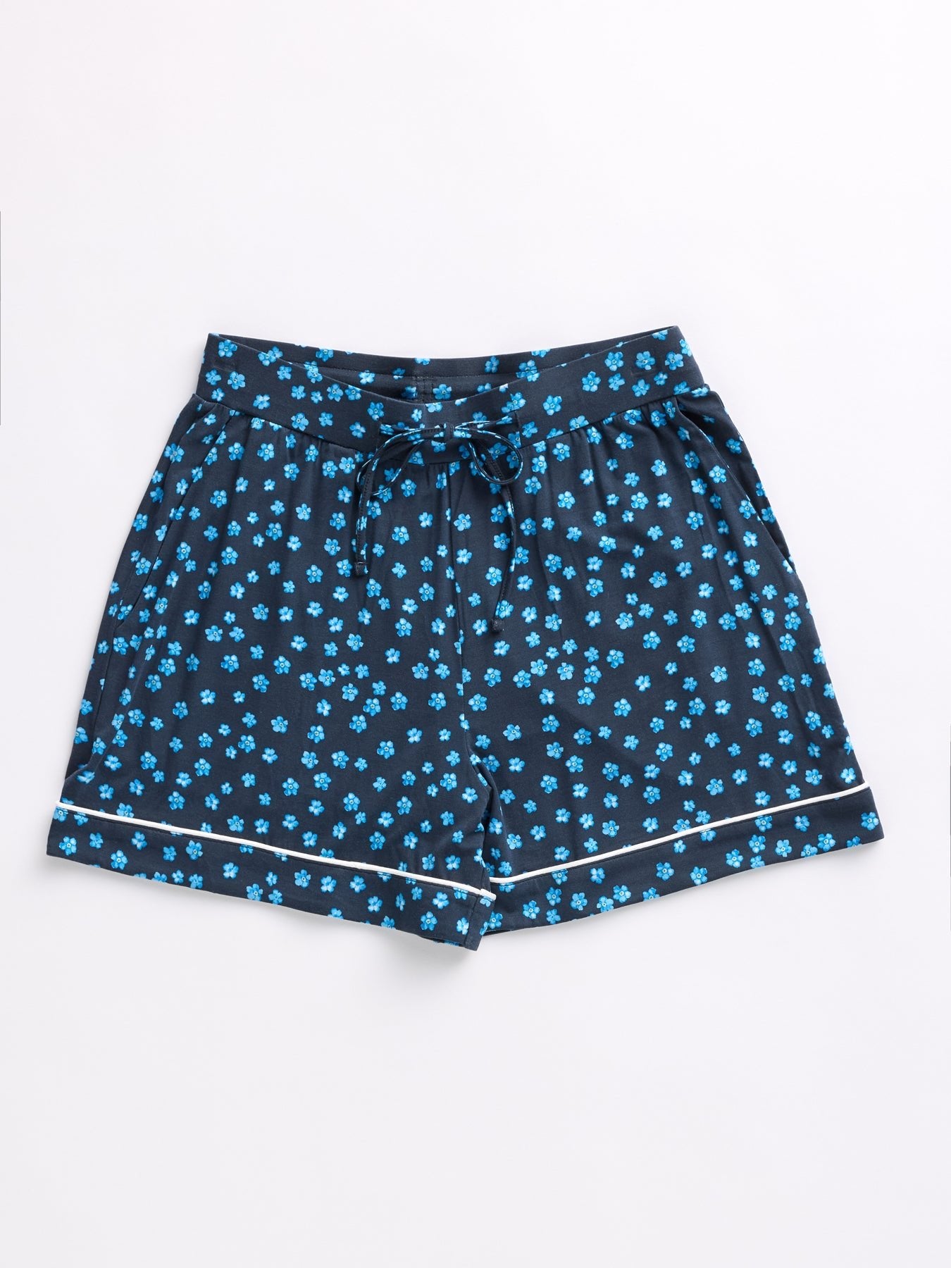 Cozy Earth Women's Bamboo Stretch-Knit Pajama Shorts, navy blue with tiny blue floral prints and white hem trim, feature an elastic waistband with a drawstring.