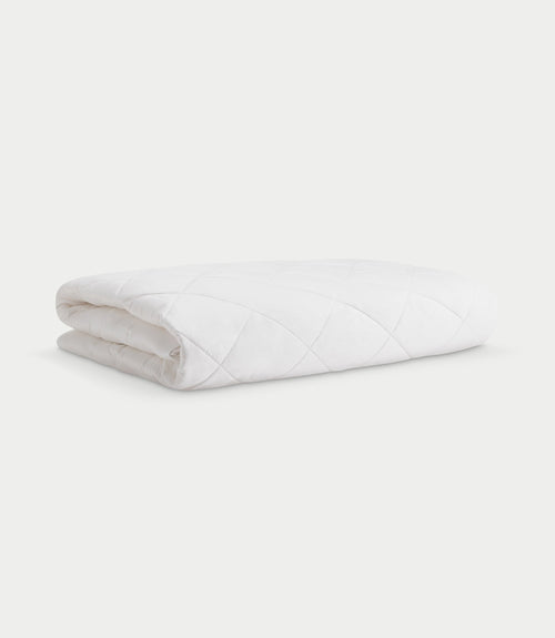 Mattress pad folded with white background