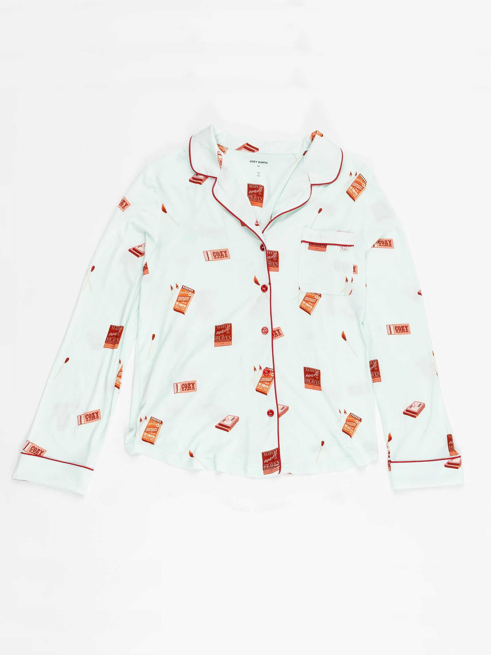 The Women's Long Sleeve Bamboo Pajama Top by Cozy Earth is stretch-knit fabric featuring red piping on the collar, sleeves, and button line.