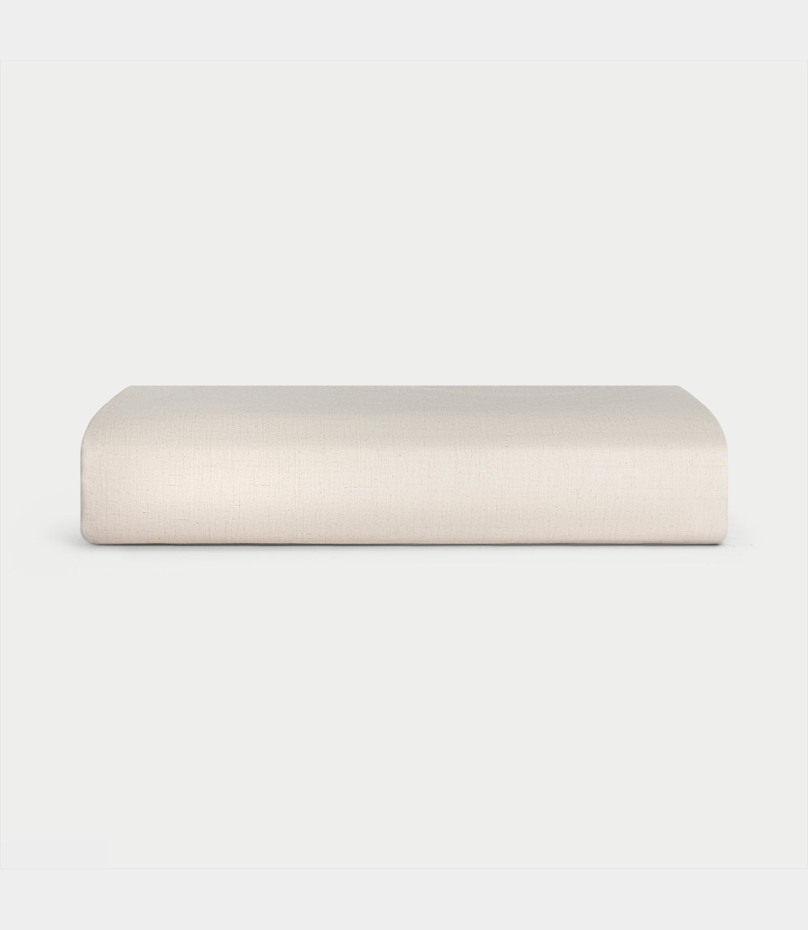 Natural Bamboo Linen Fitted Sheet Folded over a white background.