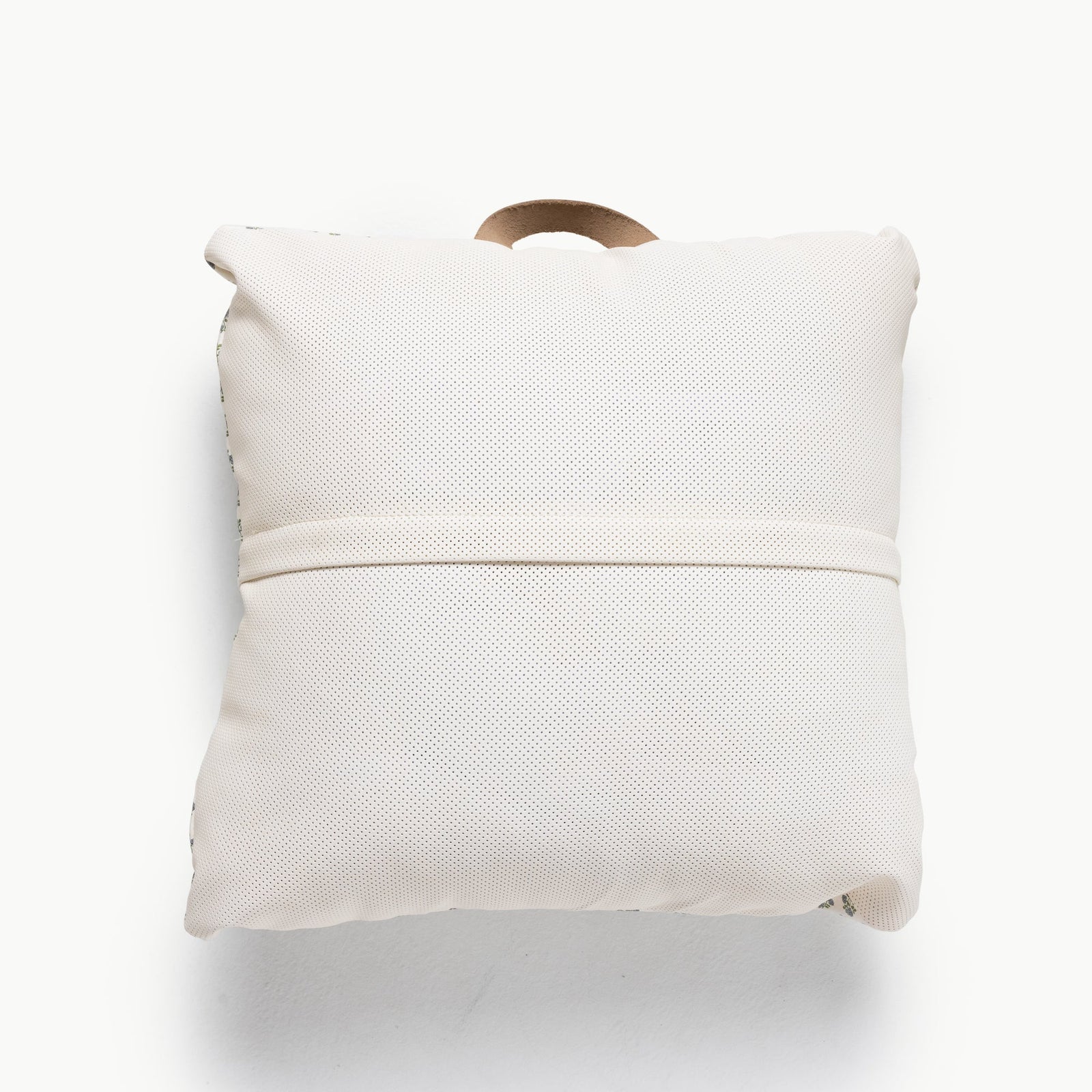 The Gathre Wholesale Floor Cushion is a white, square pillow with a textured surface, a horizontal strap across the middle, and a small beige top loop, shown on a plain white background.