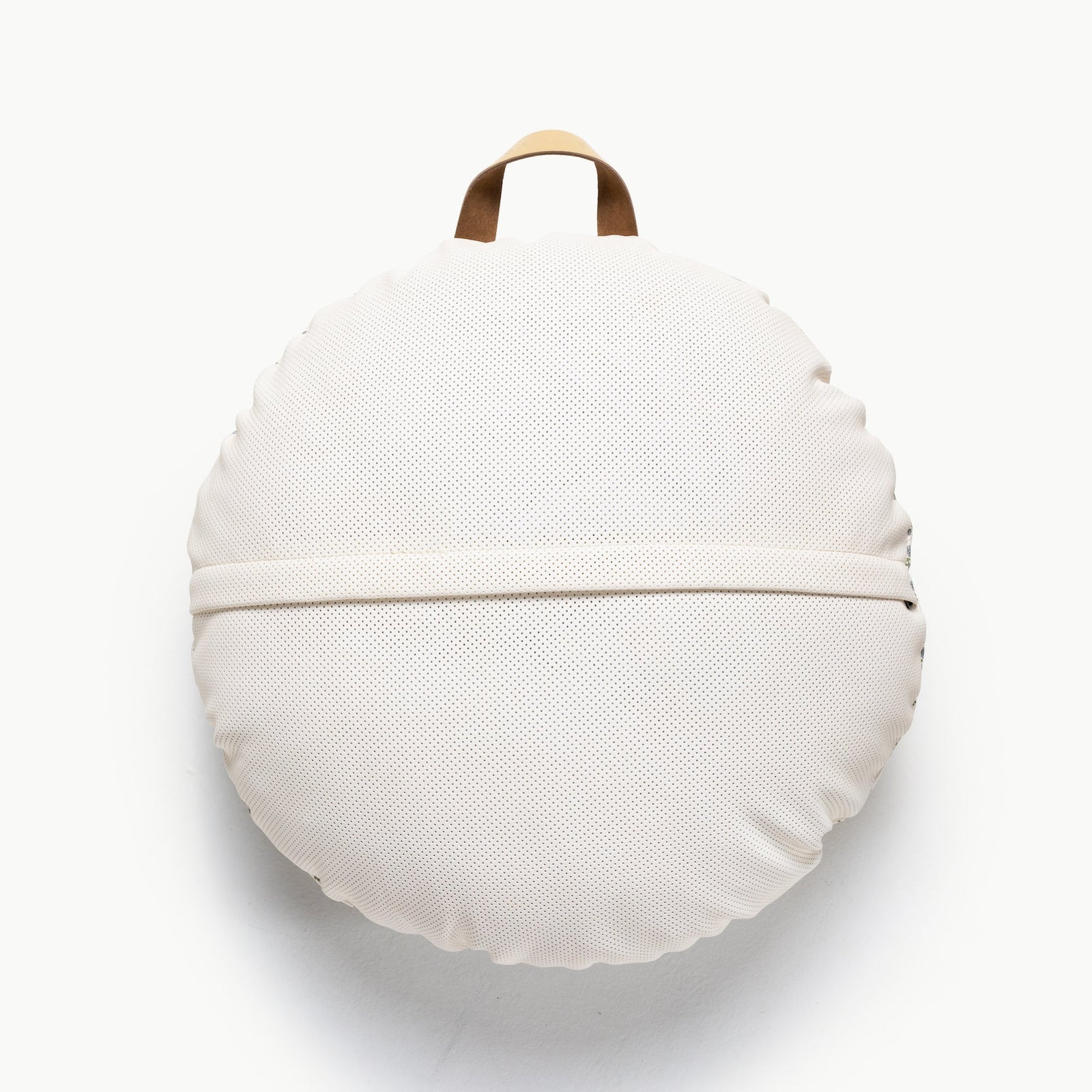 The Gathre Wholesale Floor Cushion is a round, off-white cushion with a textured surface, horizontal band across the middle, and tan carrying handle on top, shown against a plain white background.