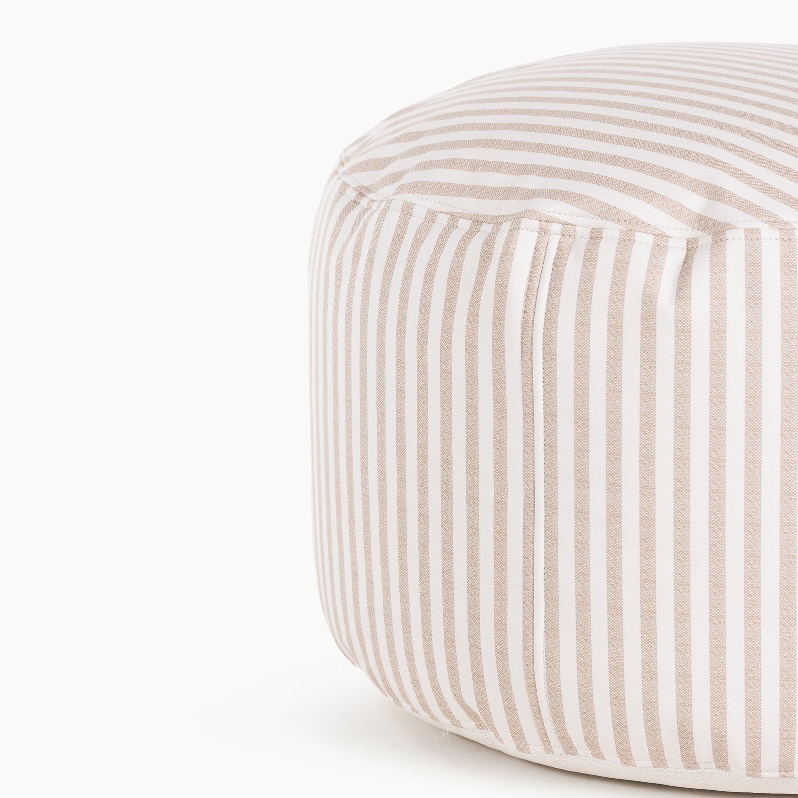 Close-up of the Gathre Wholesale Pouf, featuring round shape and vertical beige and white striped fabric, shown against a white background.