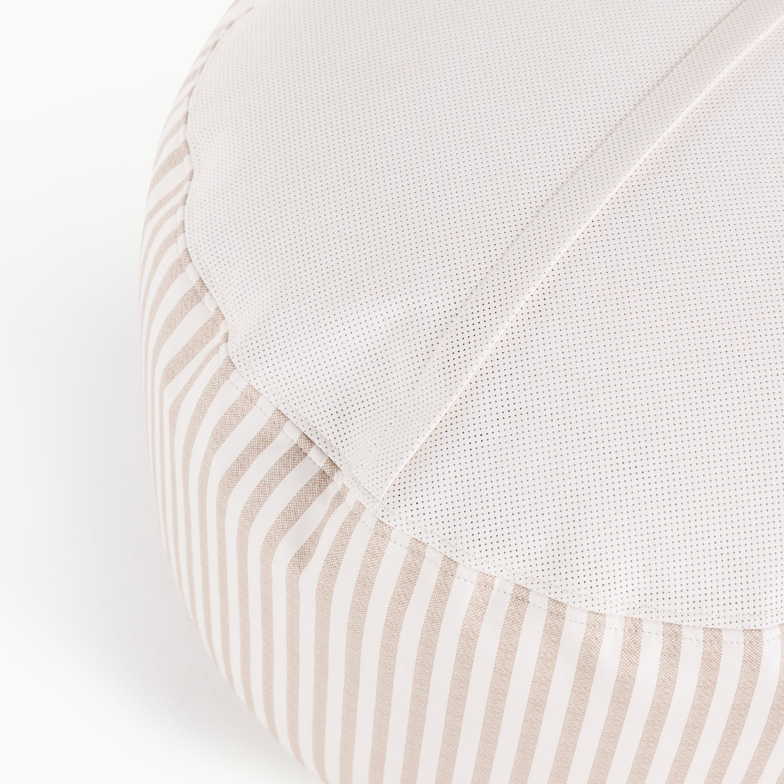 A close-up of the Gathre Wholesale Pouf highlights its beige and white vertical stripe side and textured white top, showcasing detailed stitching and fabric quality.
