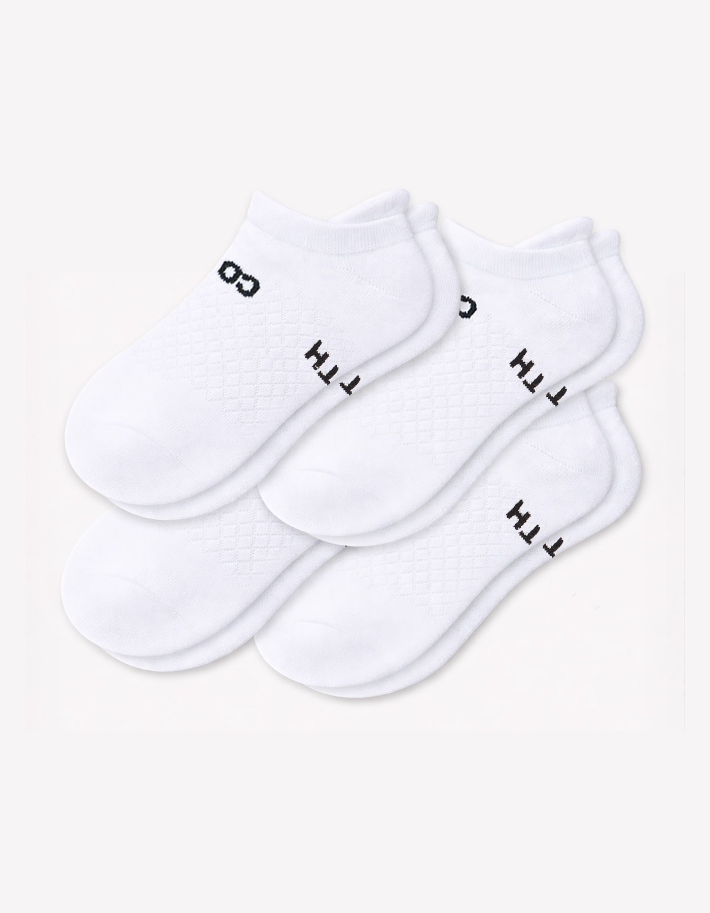 The Cozy Earth Men's Essential Ankle Sock 4-Pack features white socks with a textured top and subtle black branding on the cuffs, neatly stacked against a plain white background.|Color:White