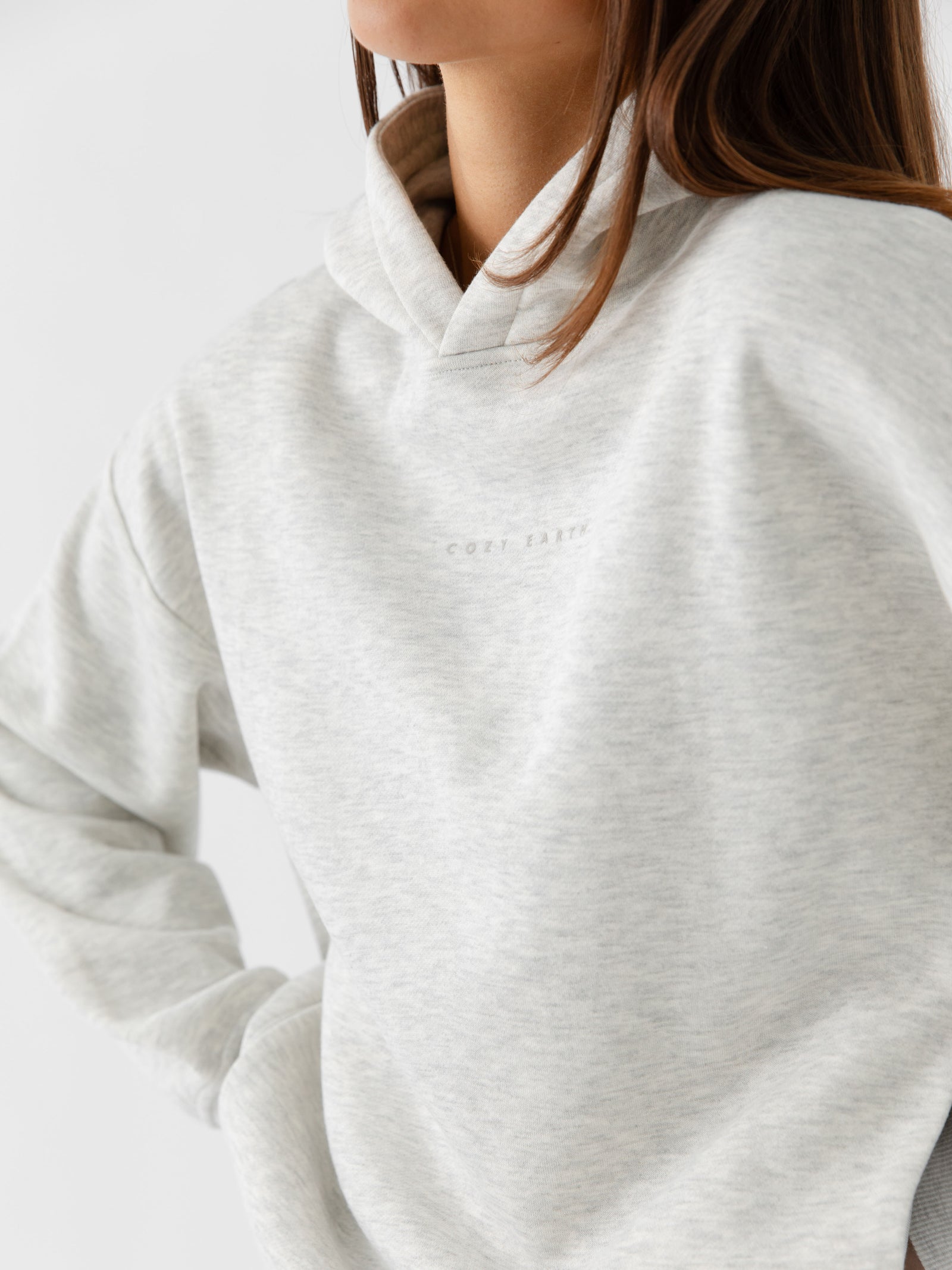 Close up of woman wearing heather grey cityscape hoodie 