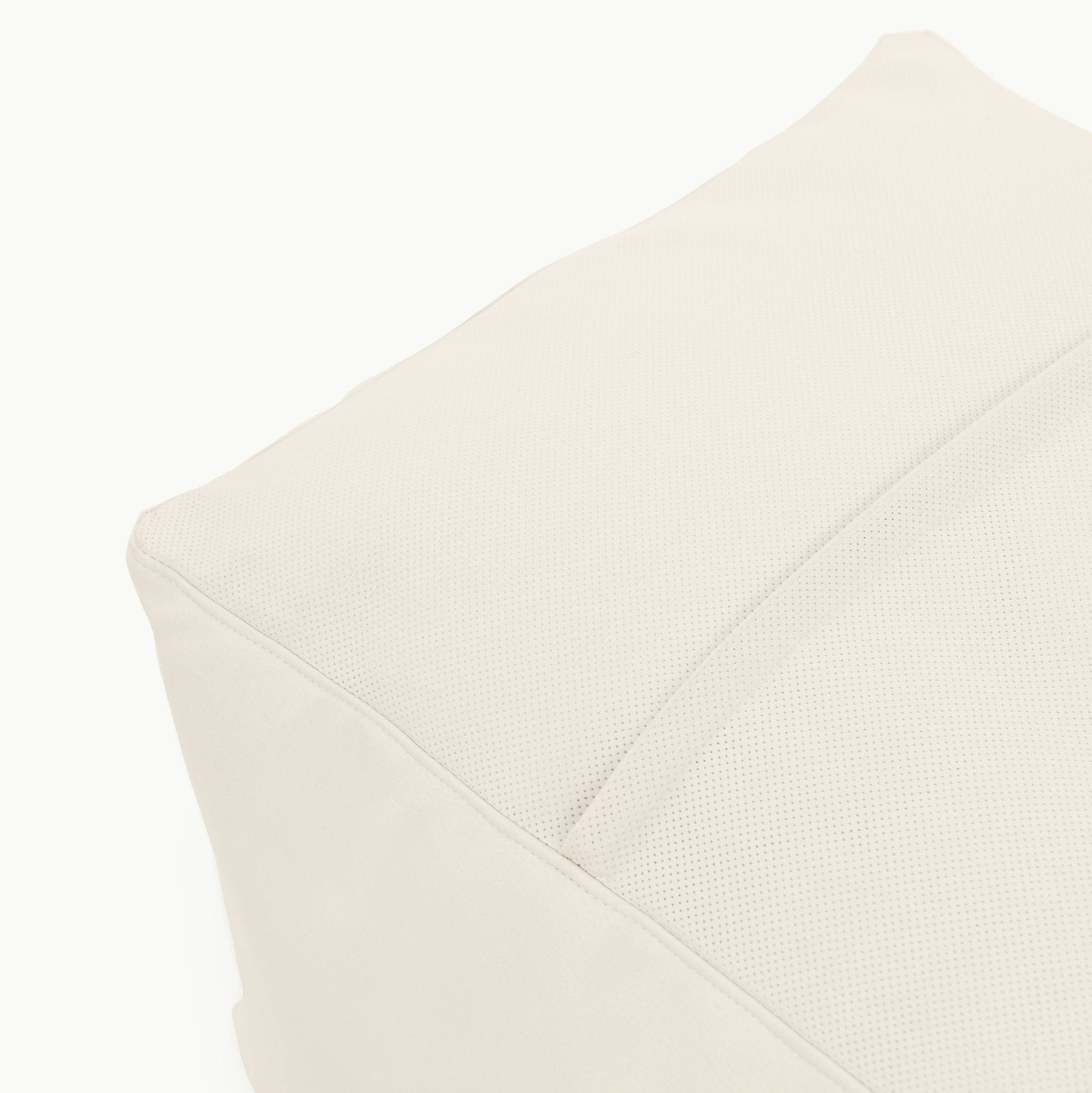 Close-up of the Gathre Wholesale Pouf, featuring light beige fabric with visible stitching and a slightly textured surface.
