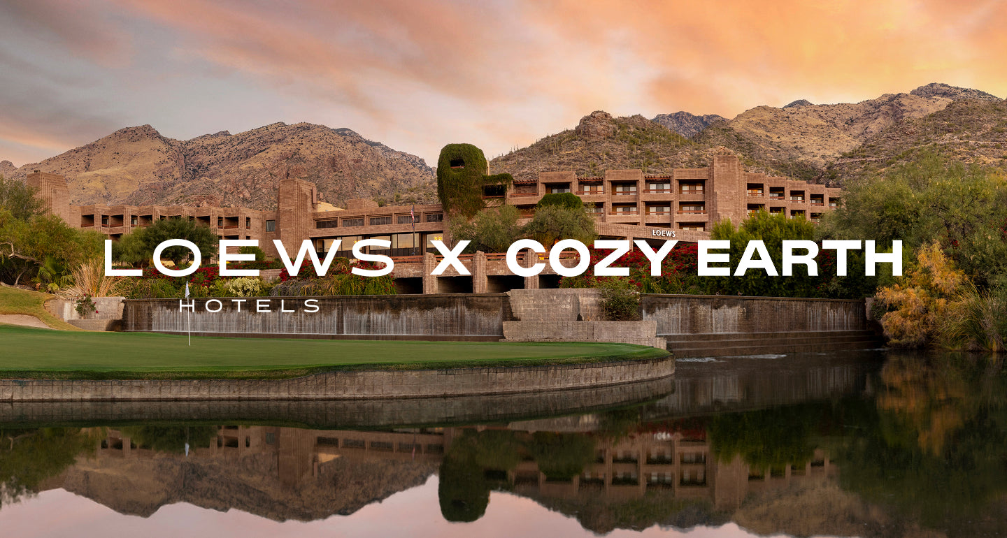 Hotel complex with mountains in the background and 'Loews X Cozy Earth Hotels' branding.