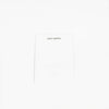 A white fabric label prominently displays the brand name "Cozy Earth" at the top, set against a plain white background to highlight its minimalist design. |Color:White