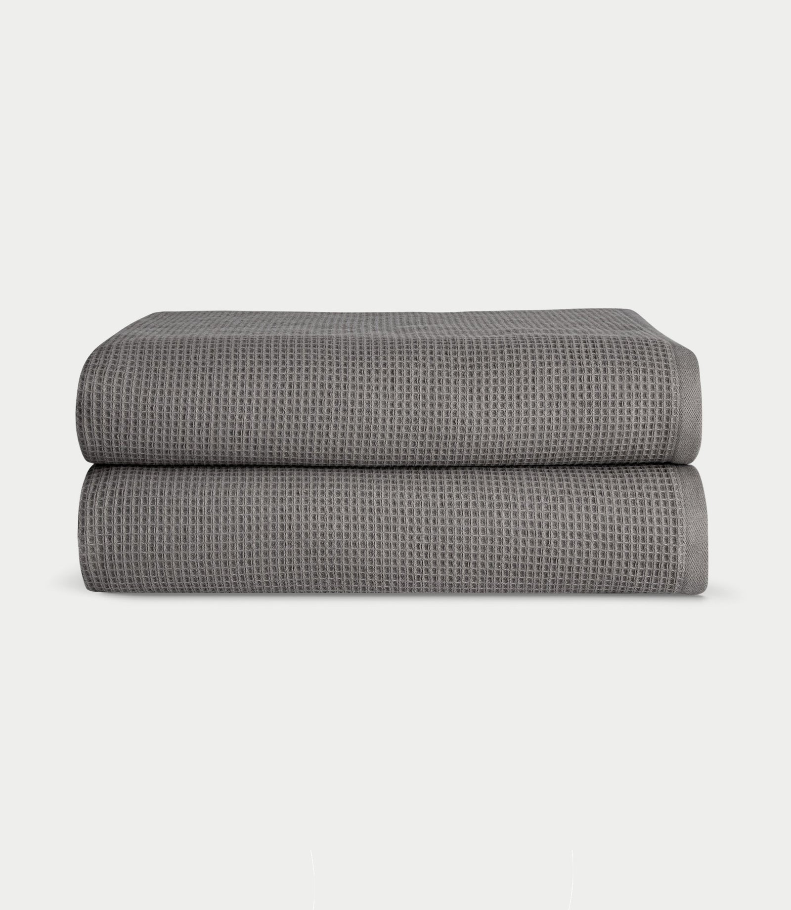 Waffle Bath Sheets in the color Charcoal. Photo of Waffle Bath Sheets taken with white a background.