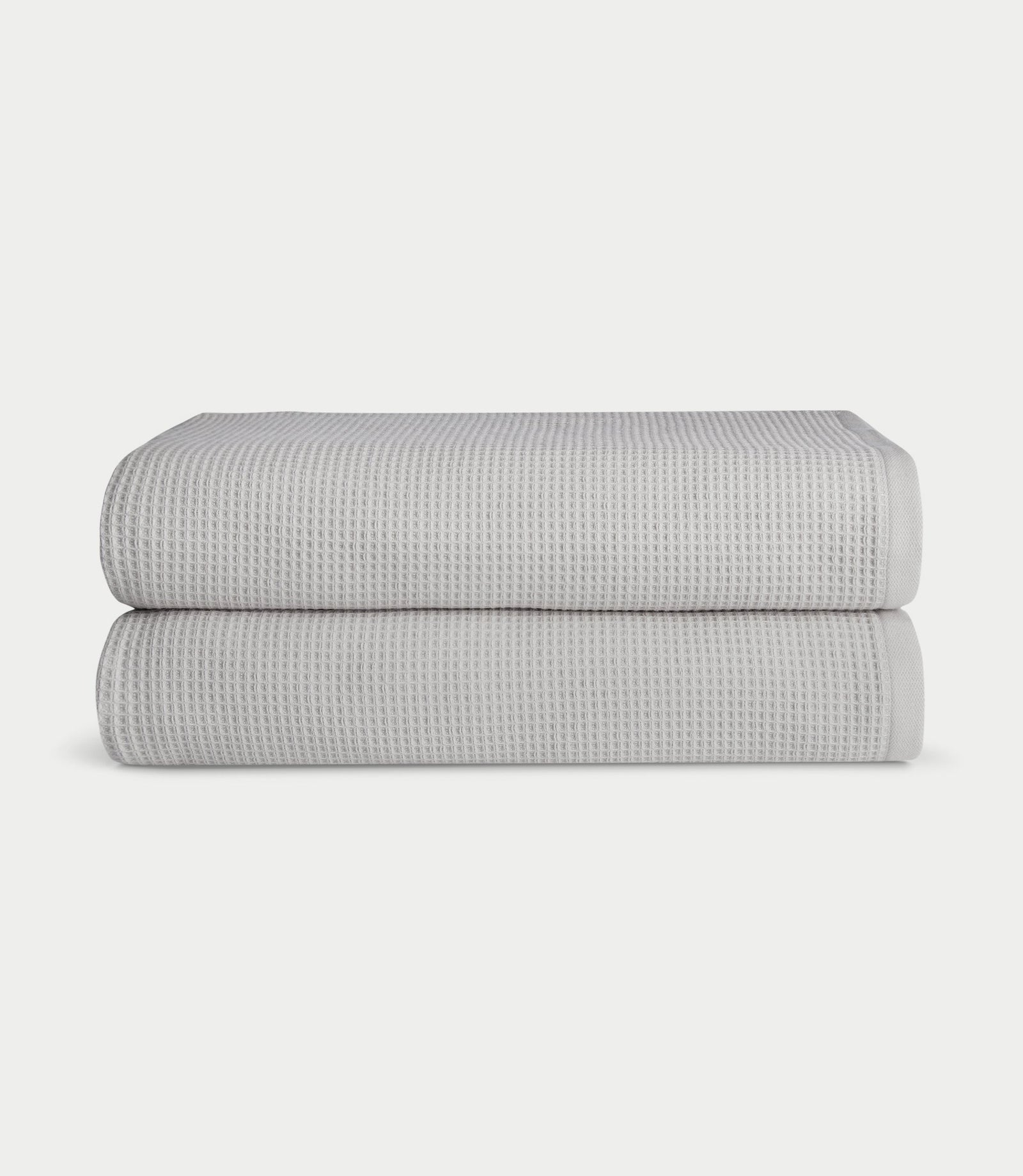 Waffle Bath Sheets in the color Light Grey. Photo of Waffle Bath Sheets taken with white a background.