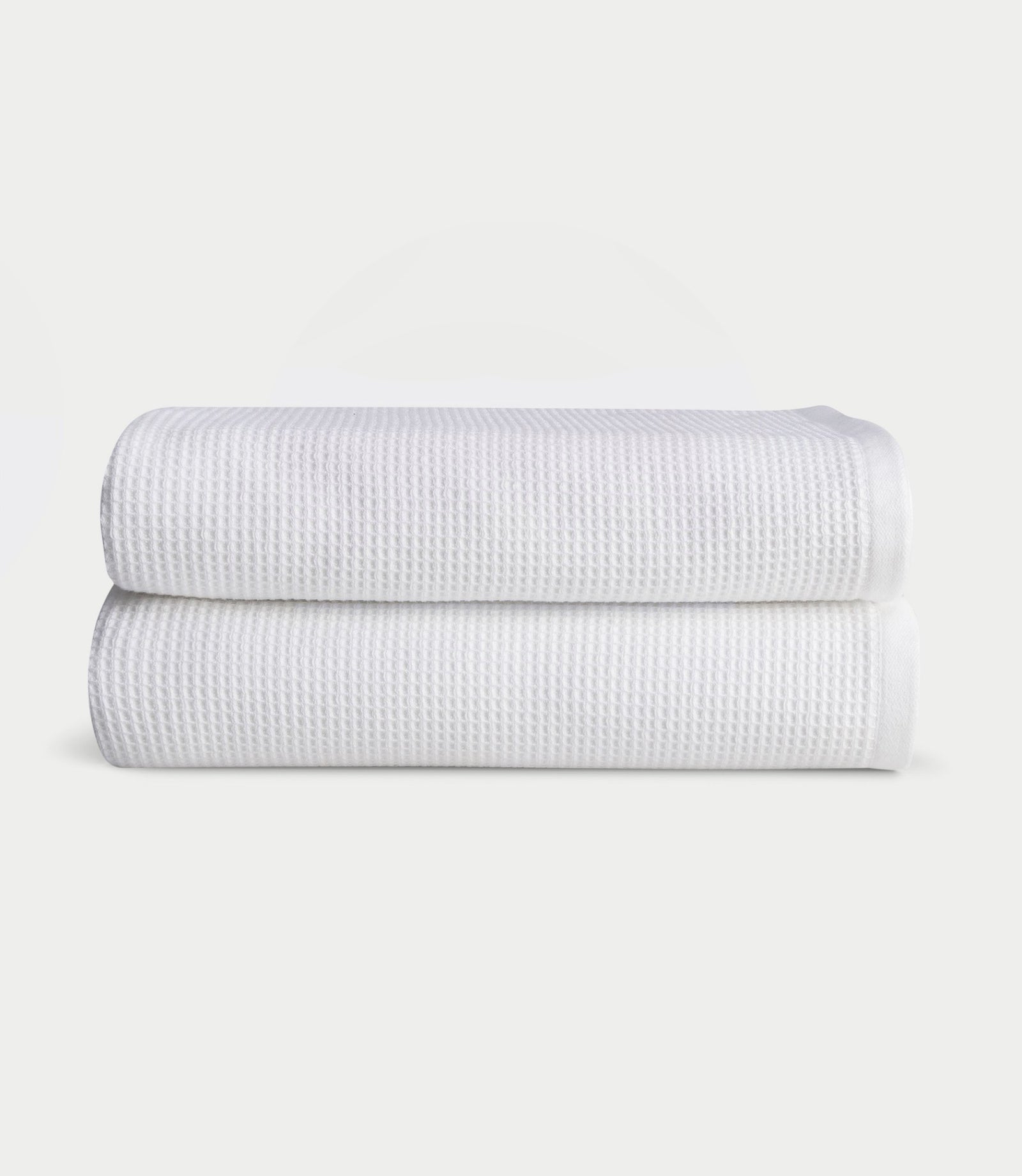 Waffle Bath towels in the color White. Photo of white Waffle Bath towels taken with white background.