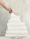 Complete Waffle Bath Bundle in the color White. Photo of White Complete Waffle Bath Bundle taken resting on a marble counter top. |Color:White