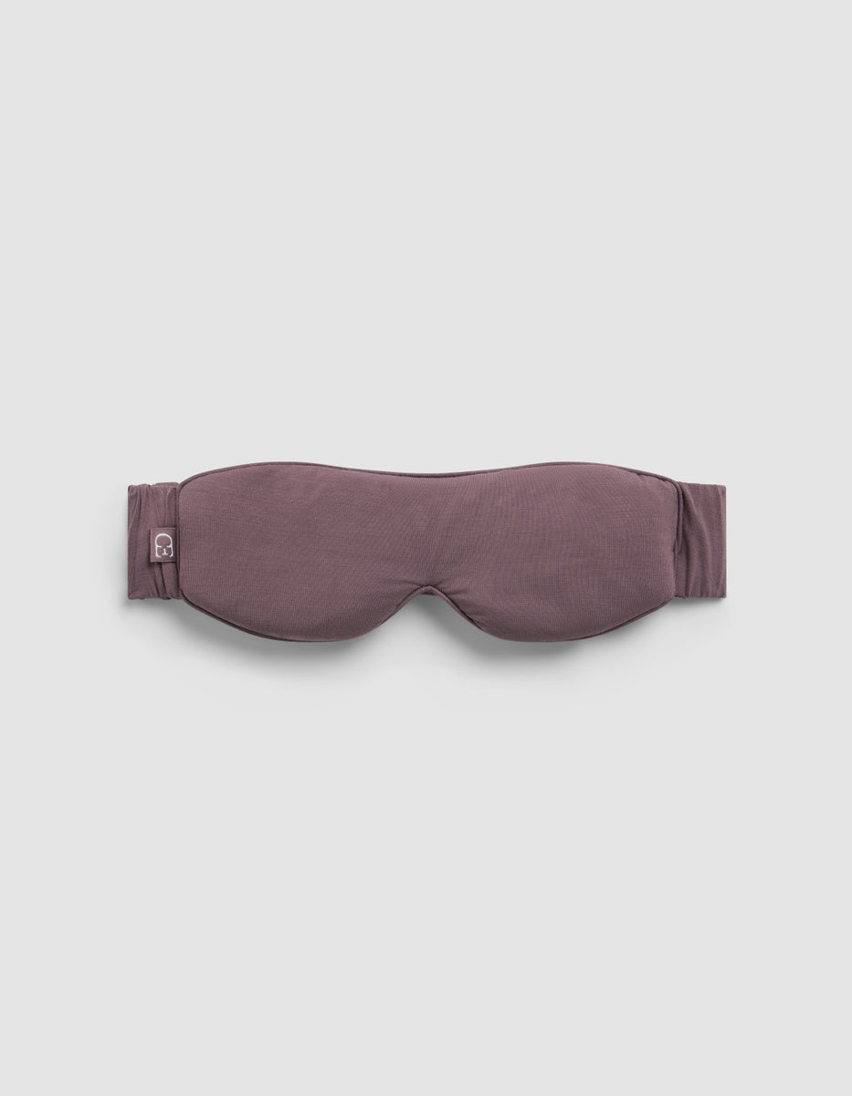 Mauve Cozy Earth Bamboo Stretch-Knit Sleep Mask with a stretchy head strap and a small logo tag on the side.|Color:Copper Rose