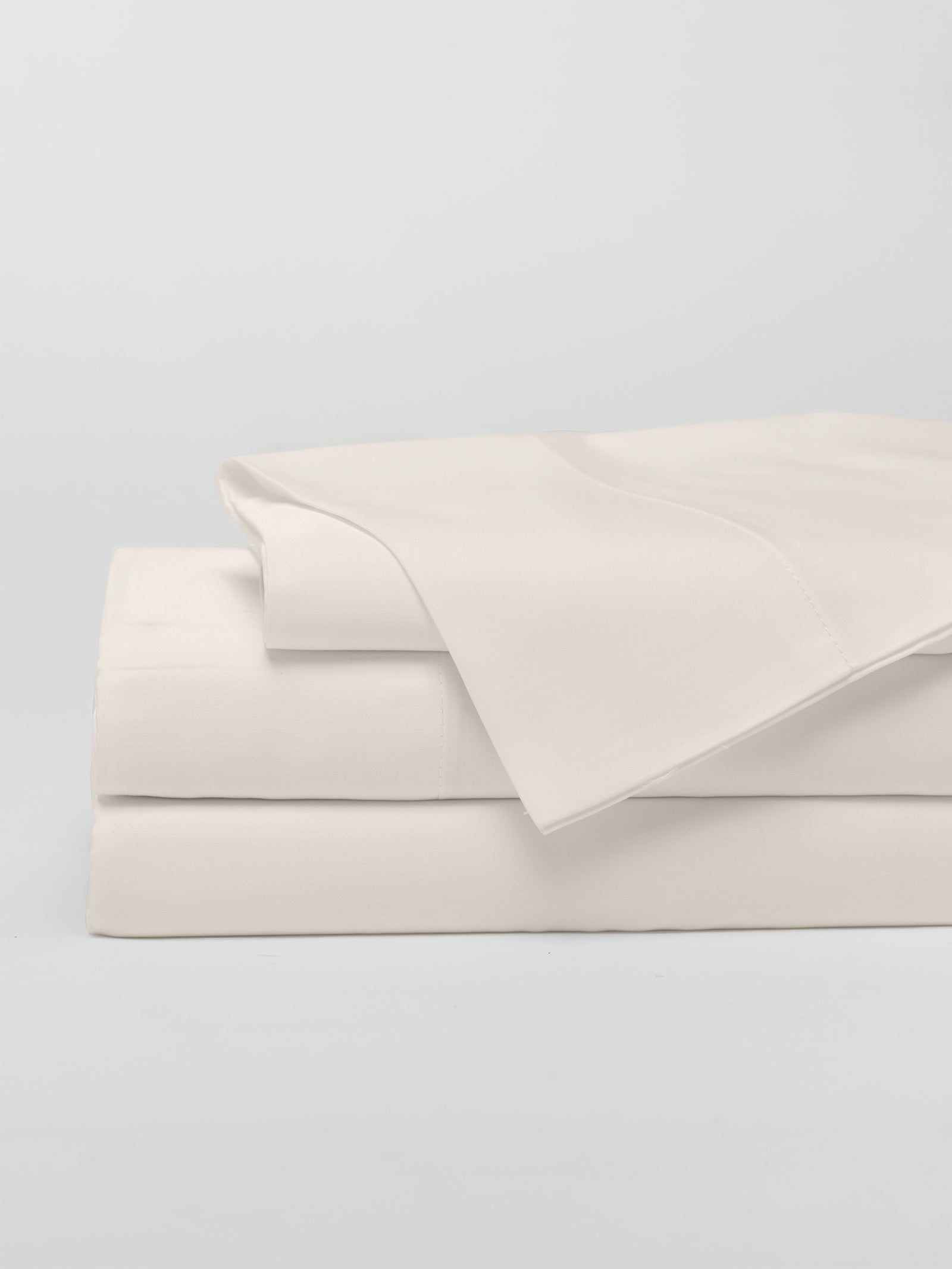 Oat sheet set folded with a white background 